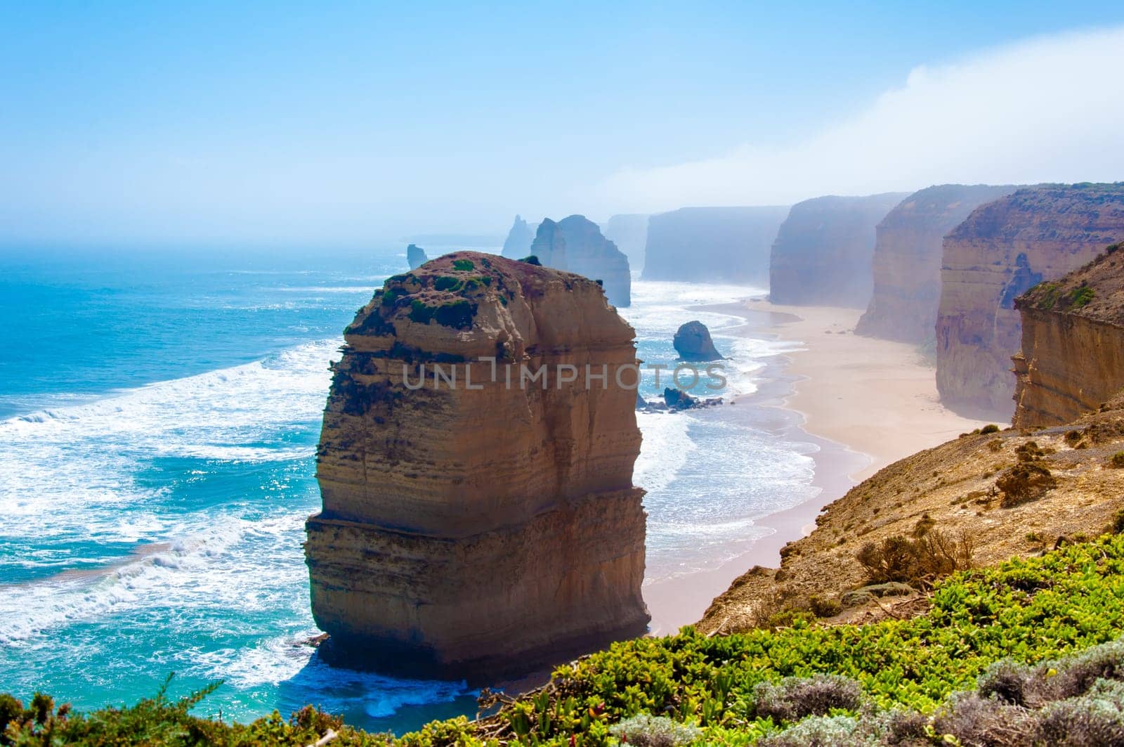The Twelve Apostles, a famous collection of limestone stacks off the shore of the Port Campbell National Park, by the Great Ocean Road in Victoria, Australia