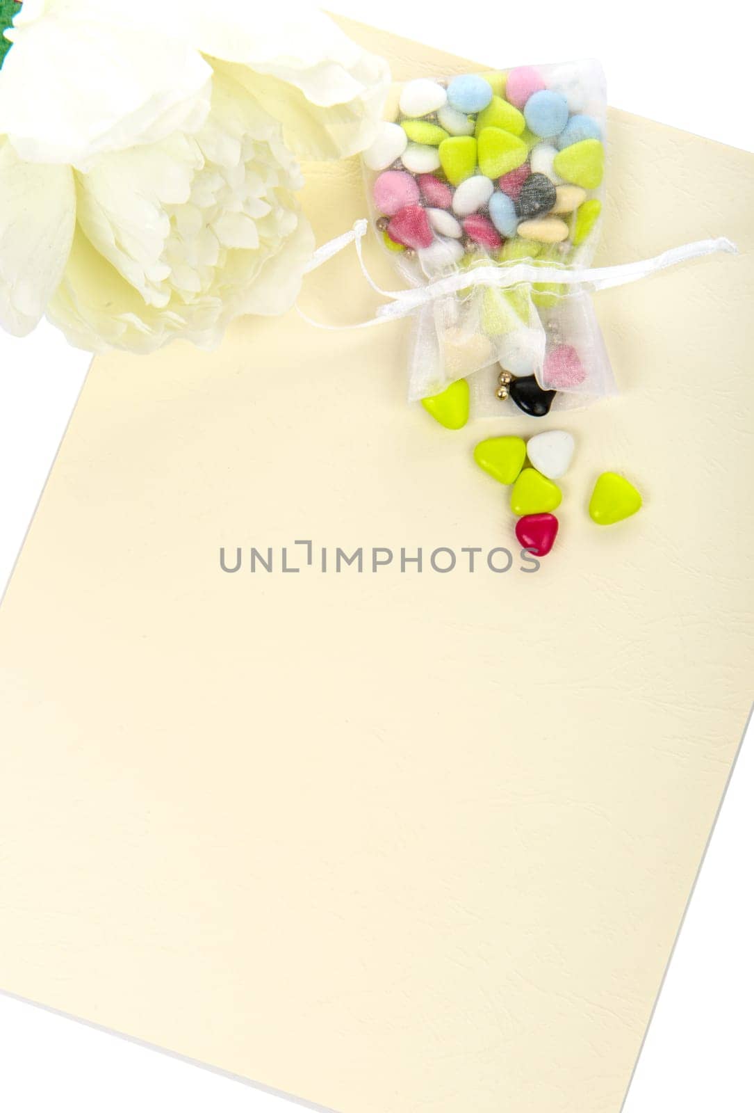 Candy with a white flower laid on a table