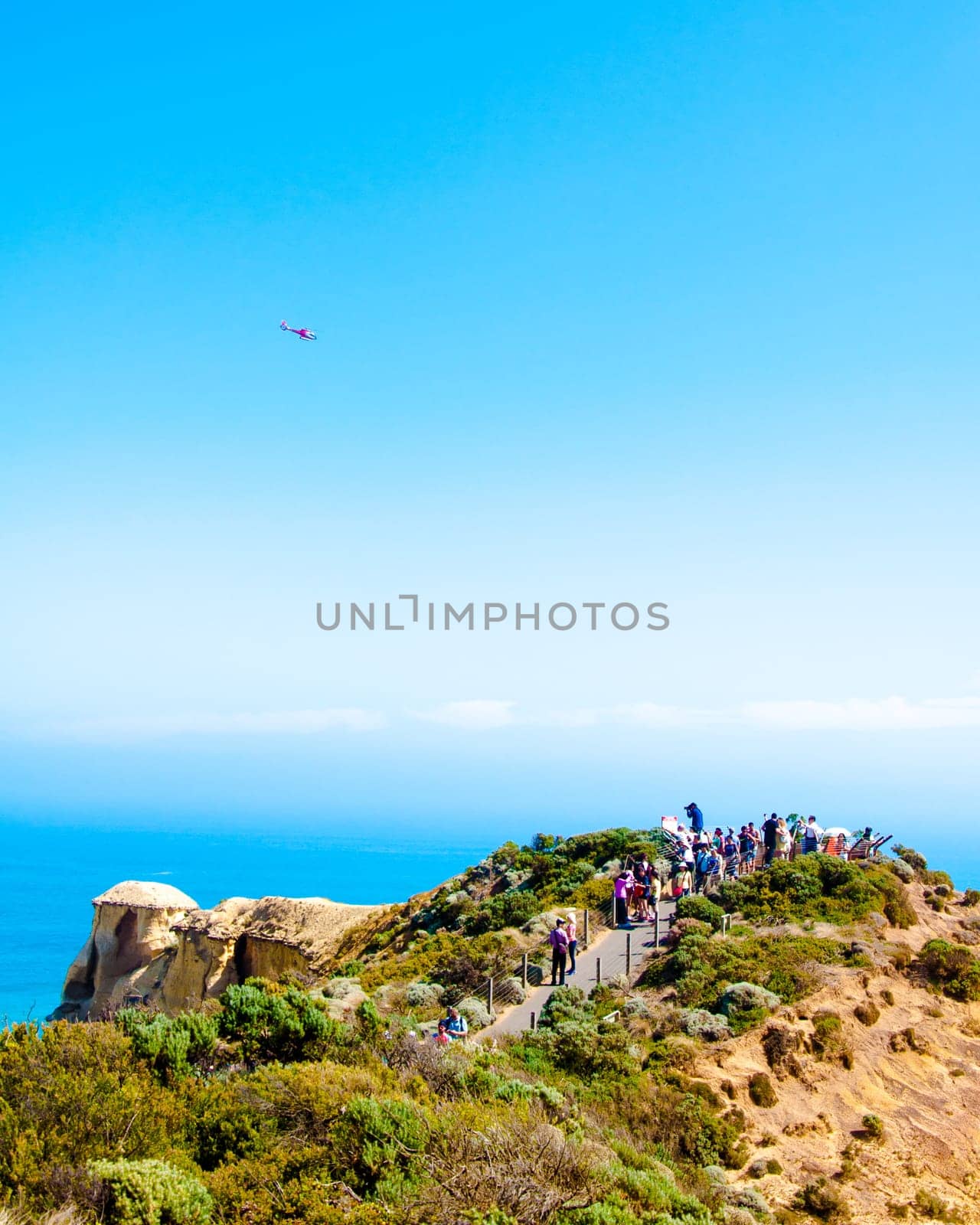 Port Campbell National Park, Victoria state, Australia - February 19, 2015: Tourists visiting the Twelve Apostles, a famous collection of limestone stacks off the shore of the Port Campbell National Park, by the Great Ocean Road in Victoria, Australia