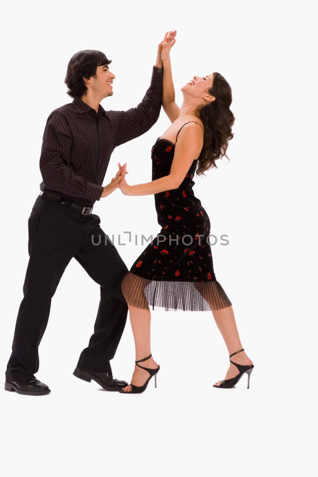 Studio portrait of couple dancing