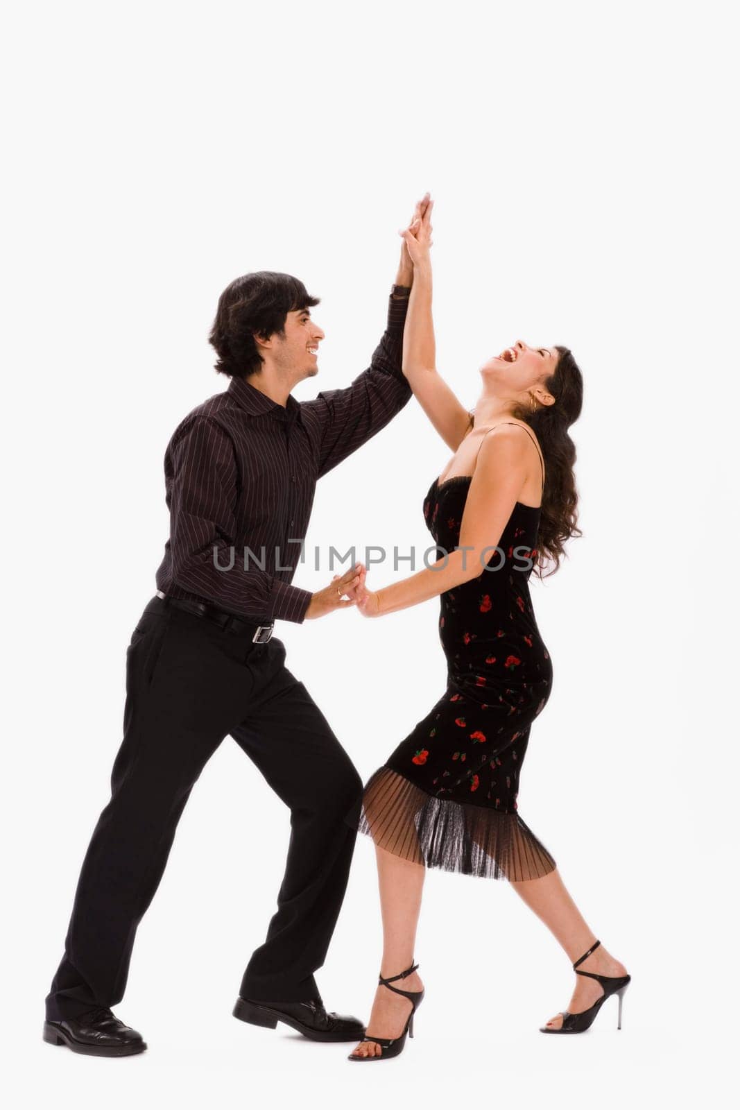 Studio portrait of couple dancing