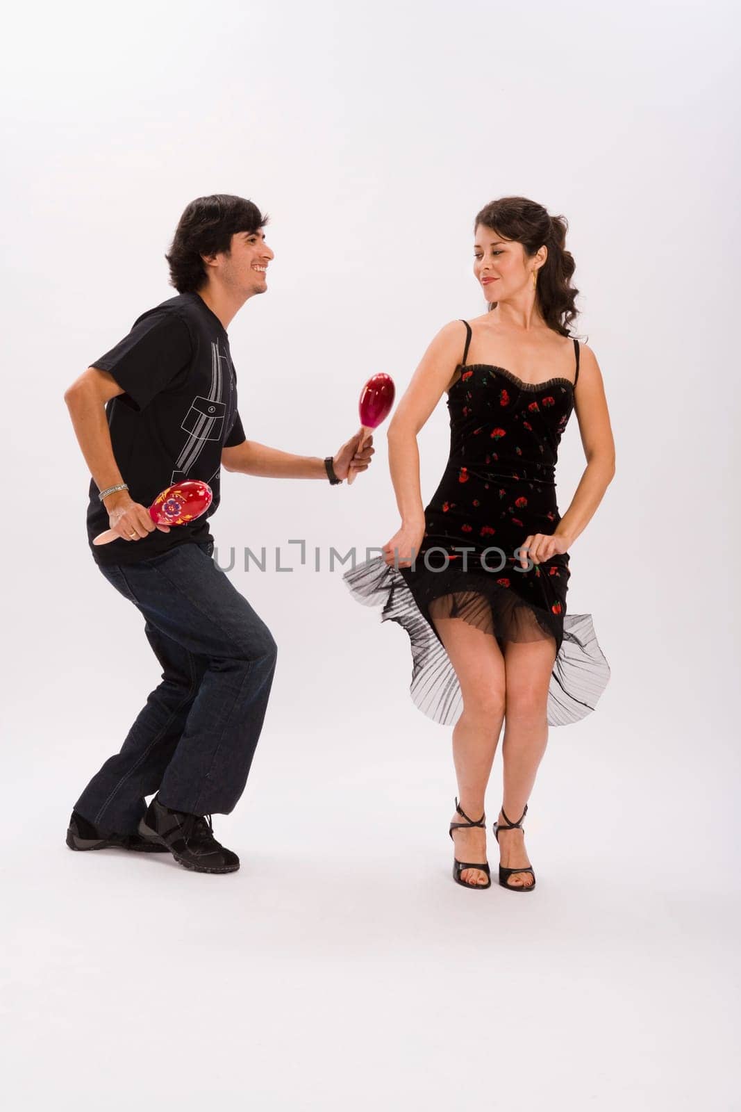 Studio portrait of couple dancing