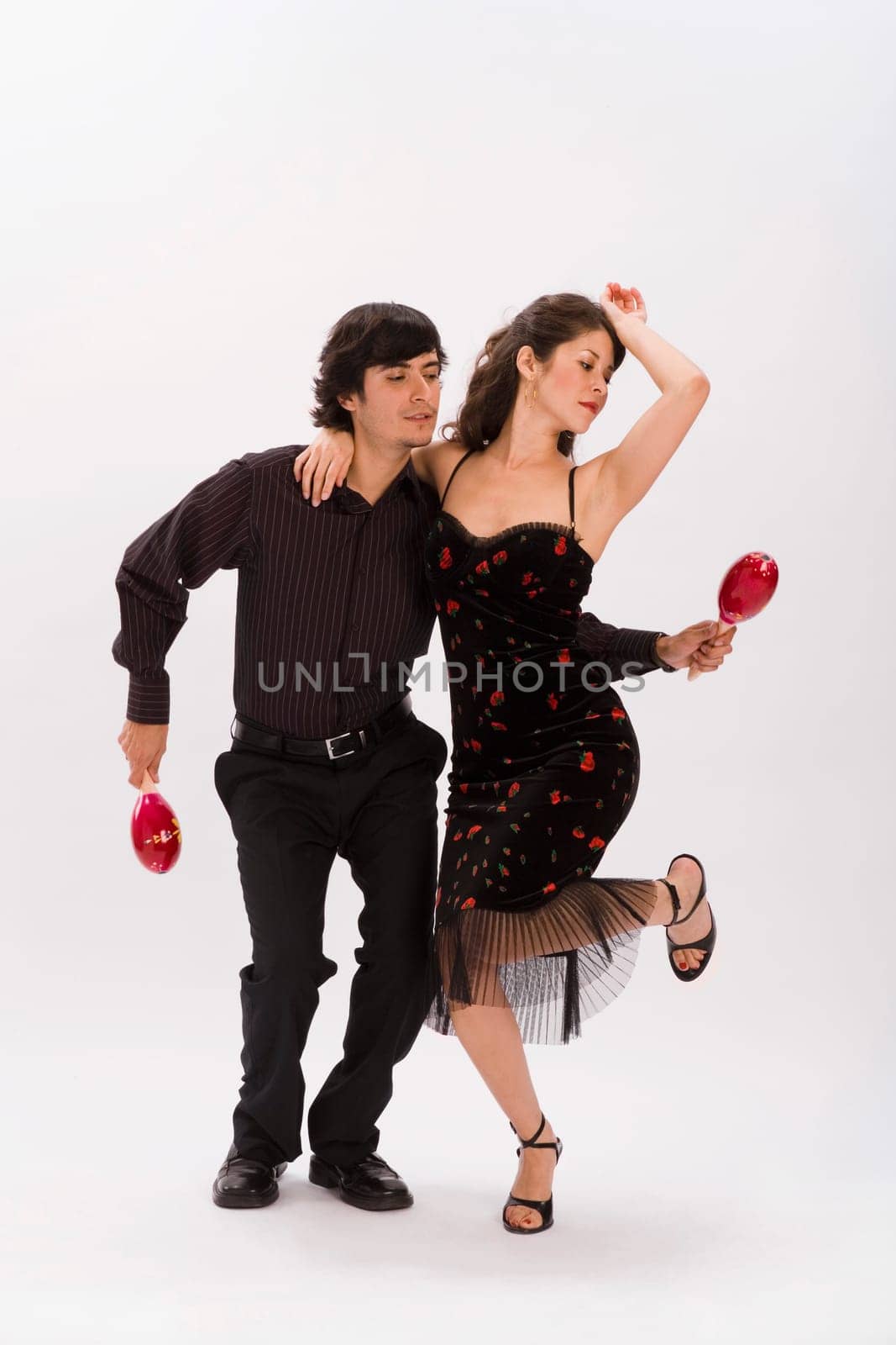 Studio portrait of couple dancing