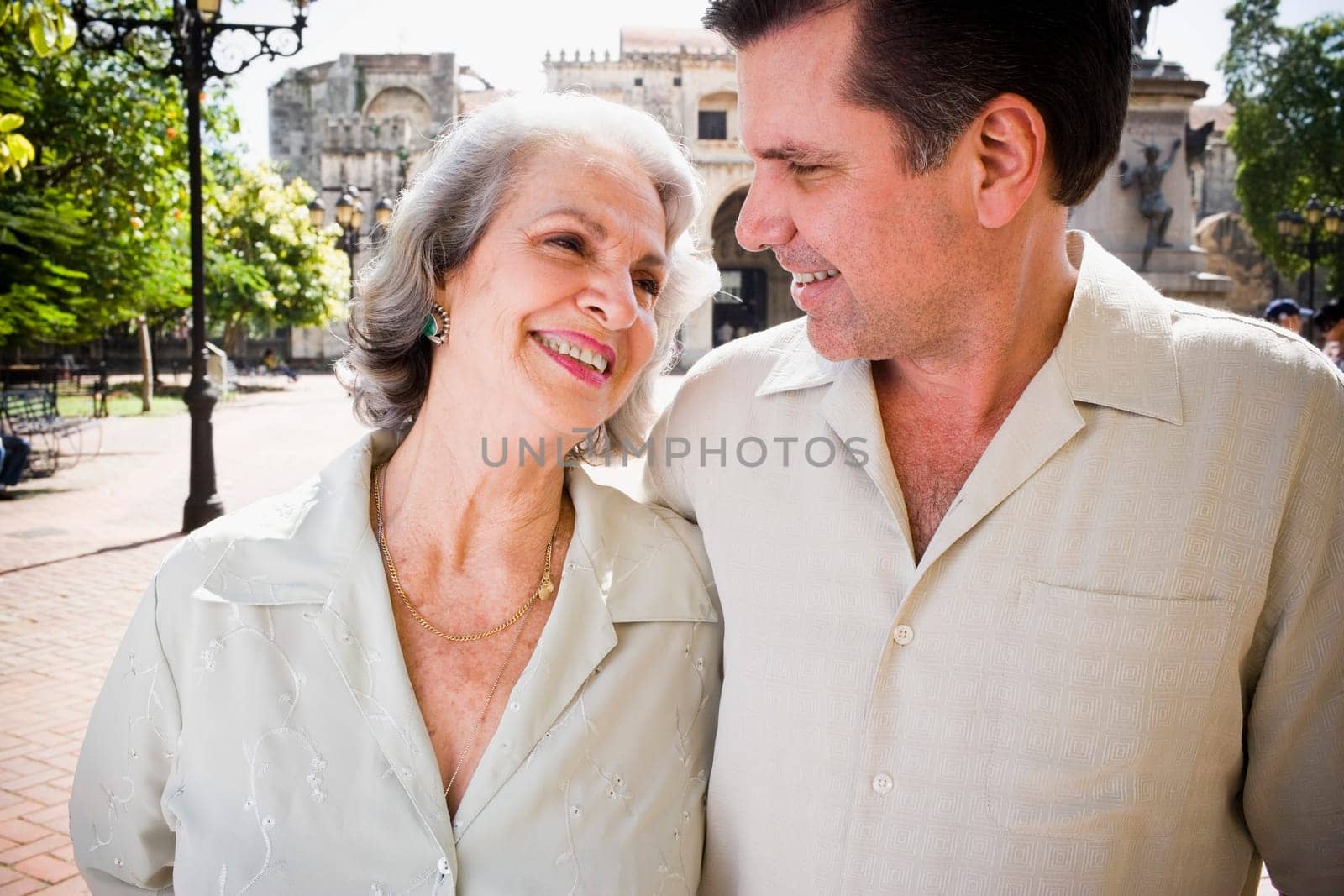 Close-up of a senior woman and her son looking at each other and smiling, Santo Domingo, Dominican Republic