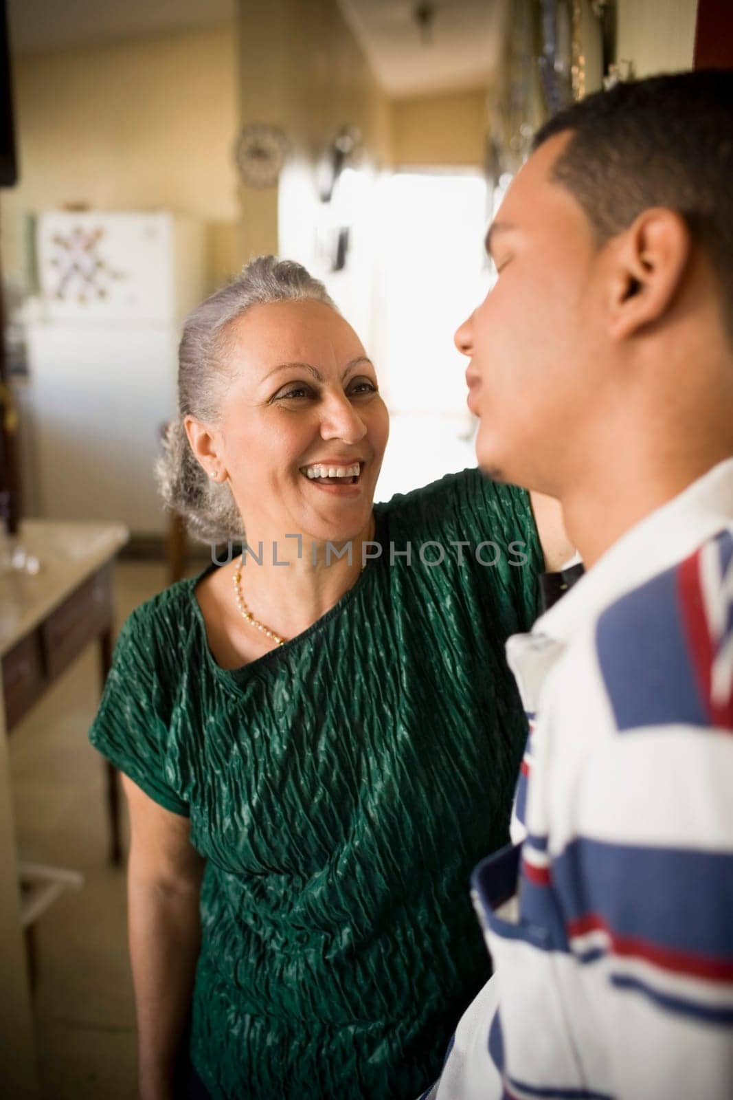 Close-up of a mature woman looking at her grandson and smiling