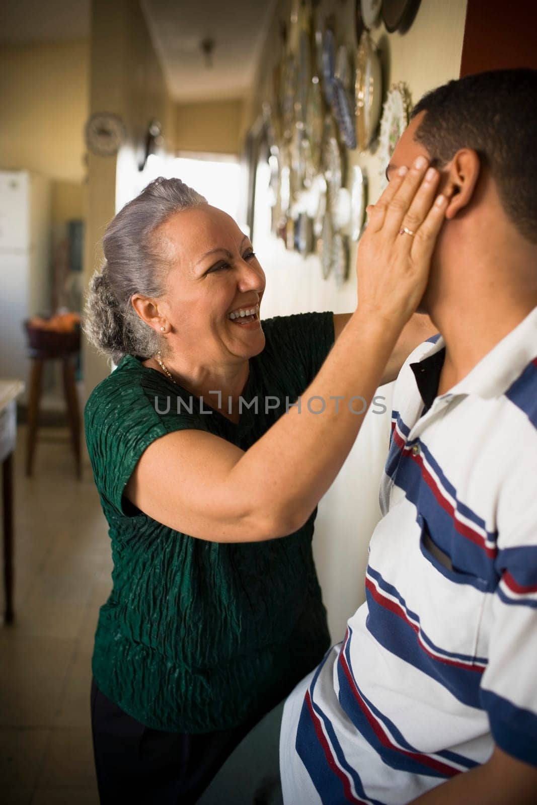 Close-up of a mature woman looking at her grandson and smiling