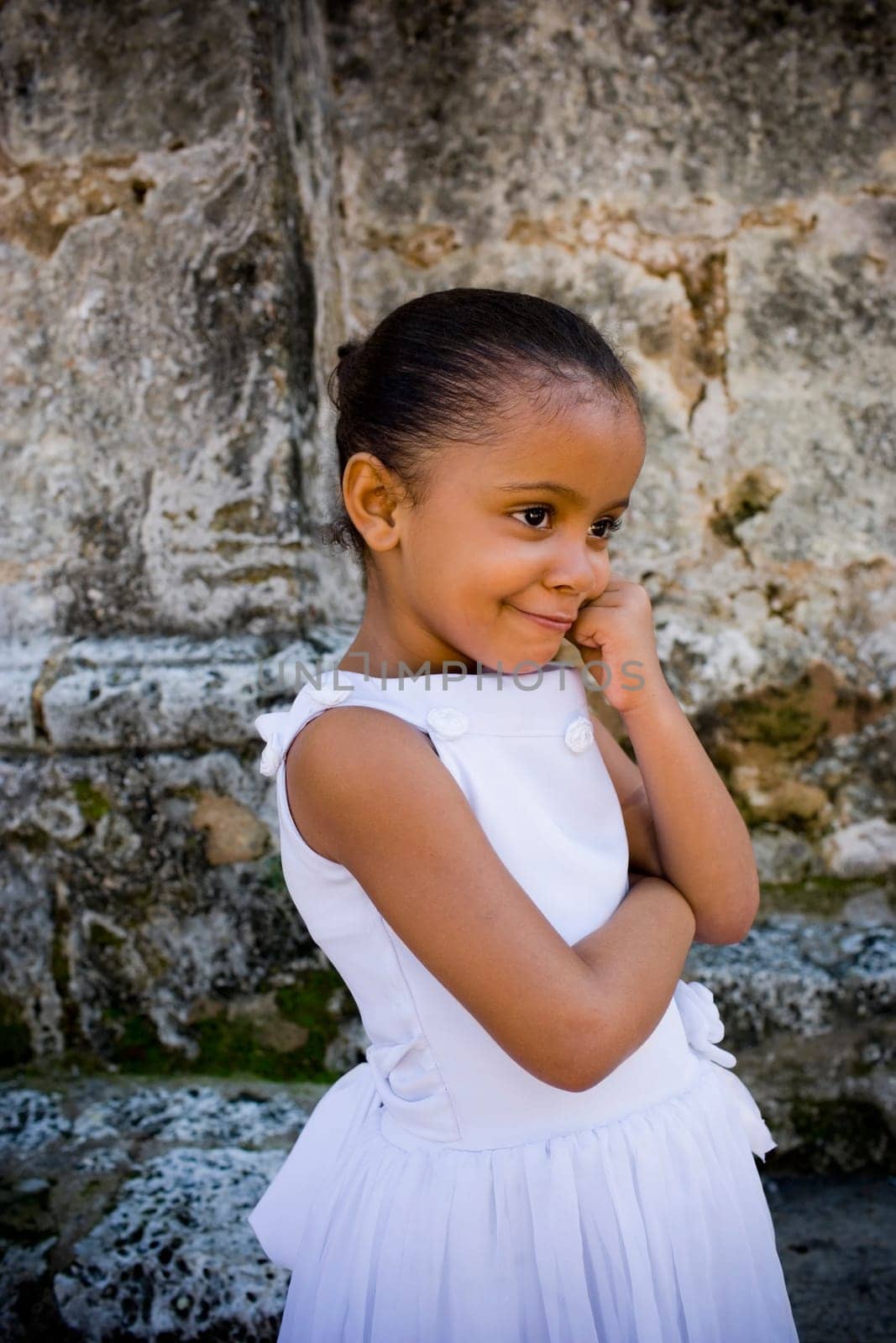 Close-up of a girl smiling with her hand on her chin, Santo Domingo, Dominican Republic