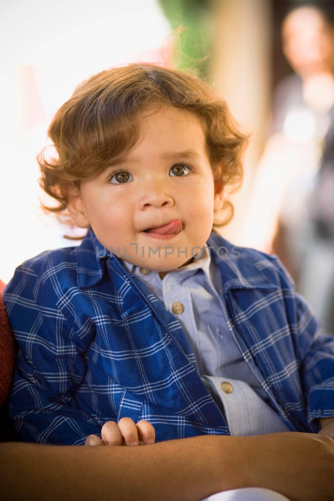 Close-up of a baby boy sticking out his tongue
