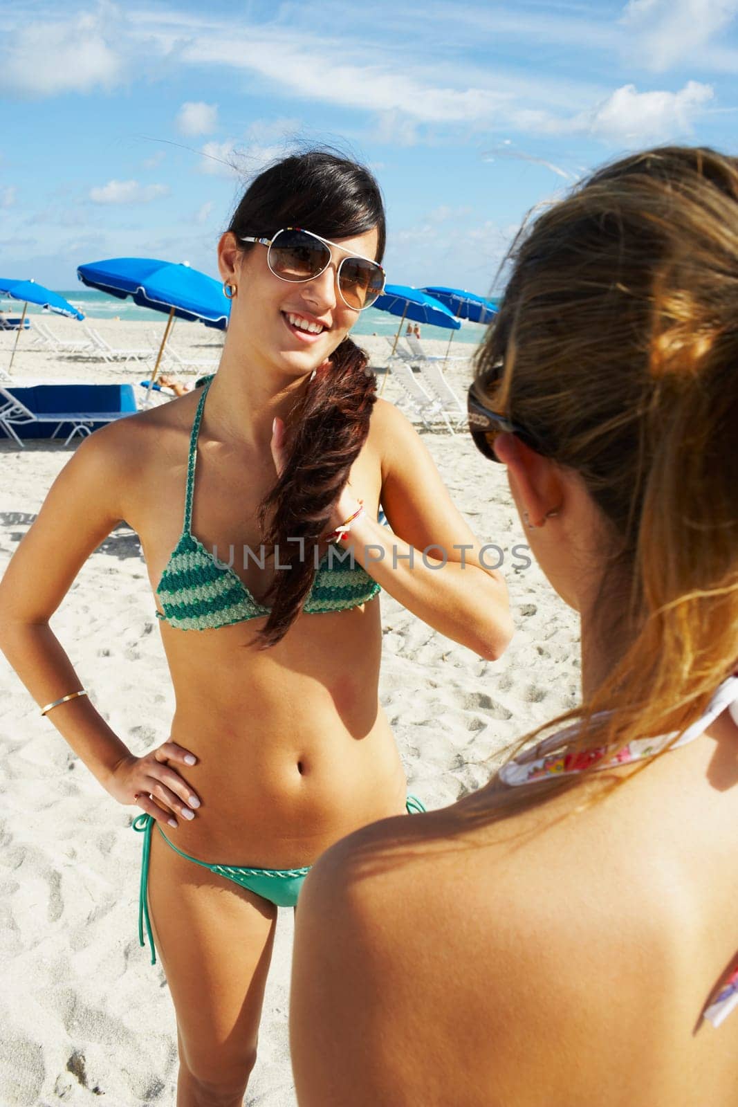 Young women hanging out on the beach