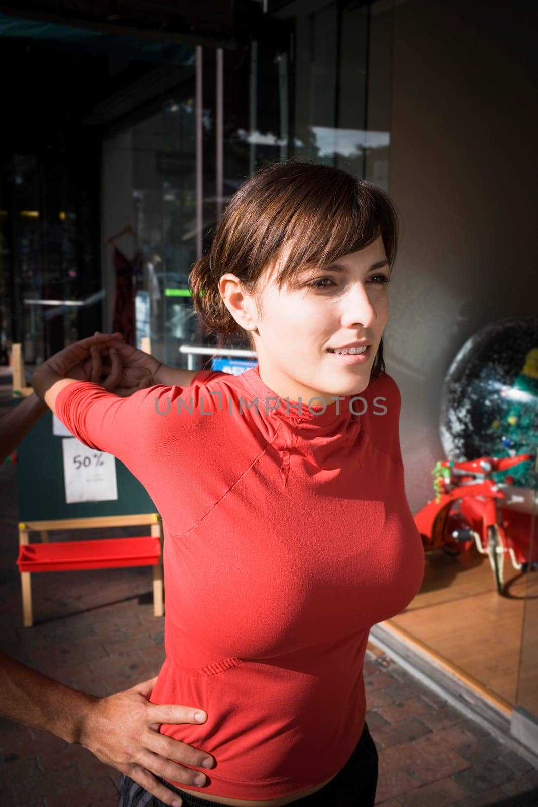 Young woman exercising with physical trainer