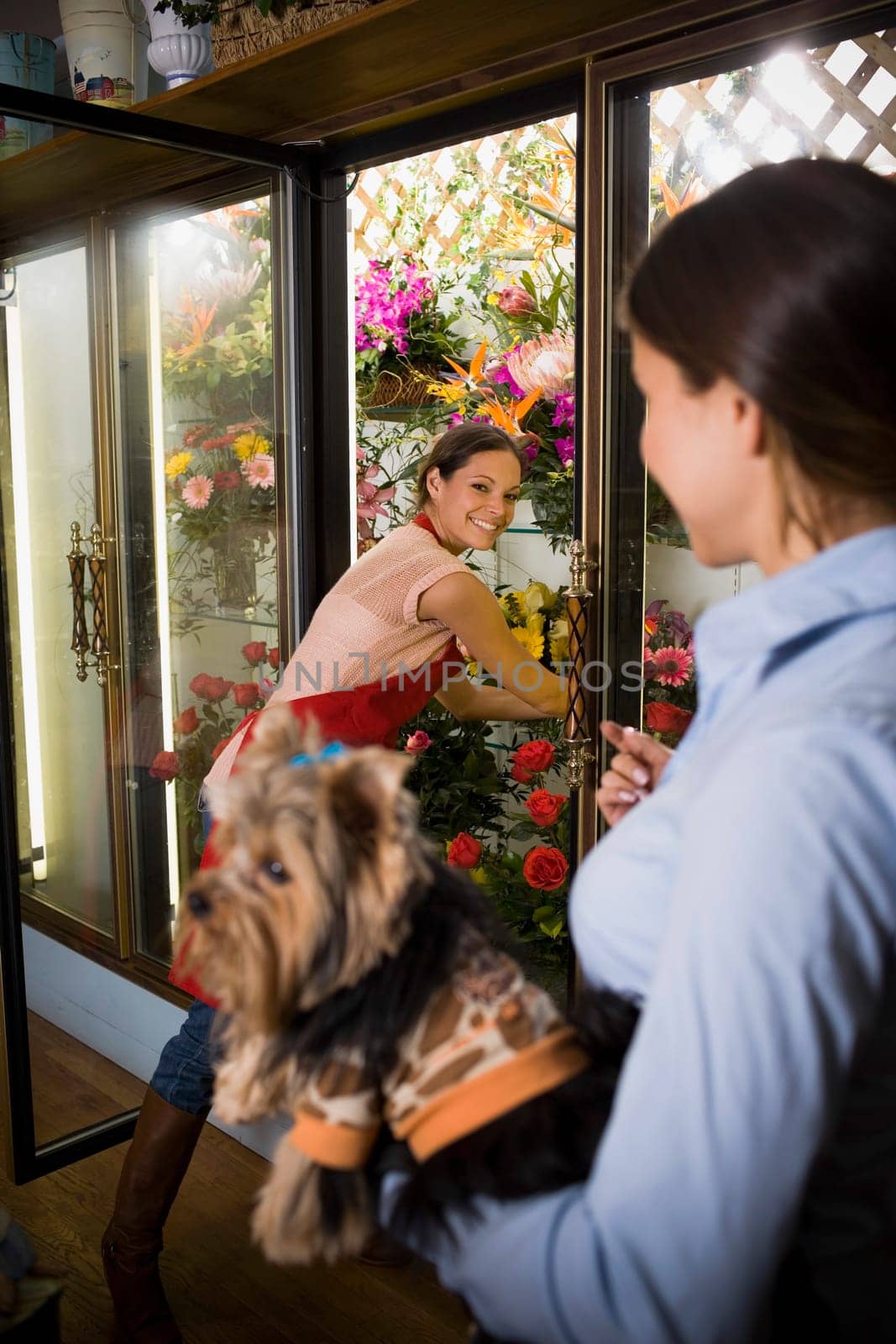 Flower shop owner helping customer