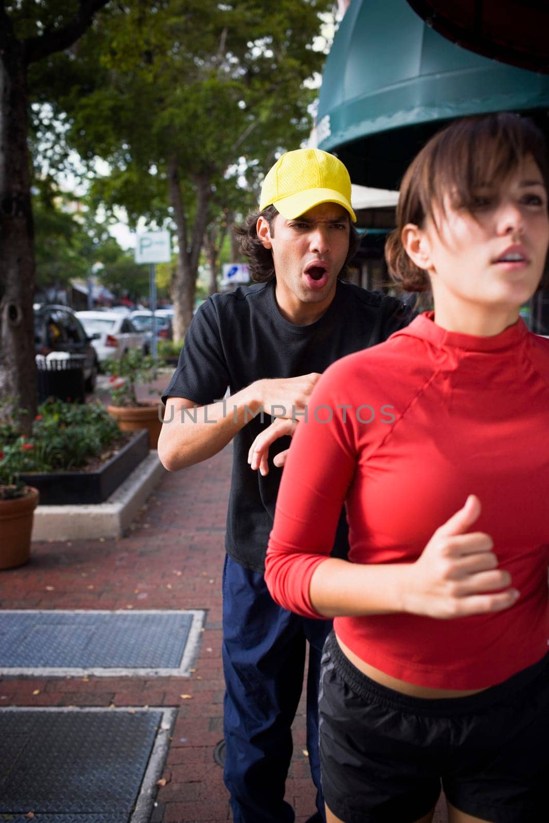 Young woman exercising with physical trainer