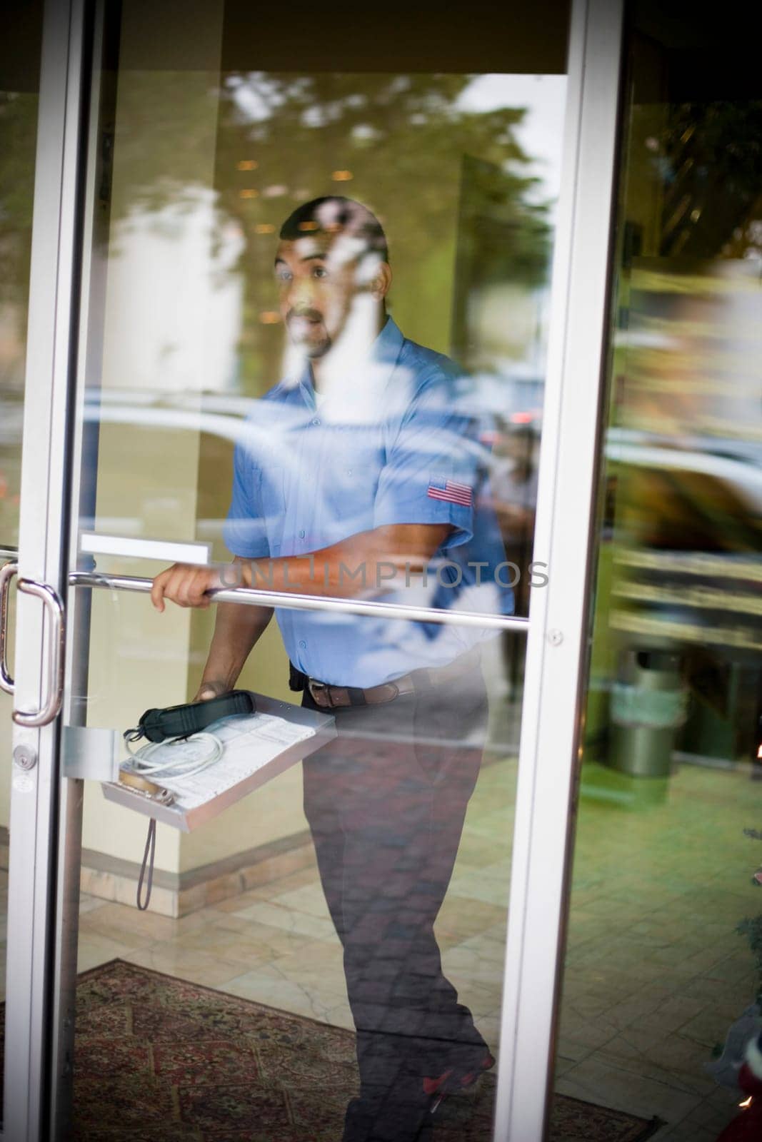 Cable man walking out of building outdoors
