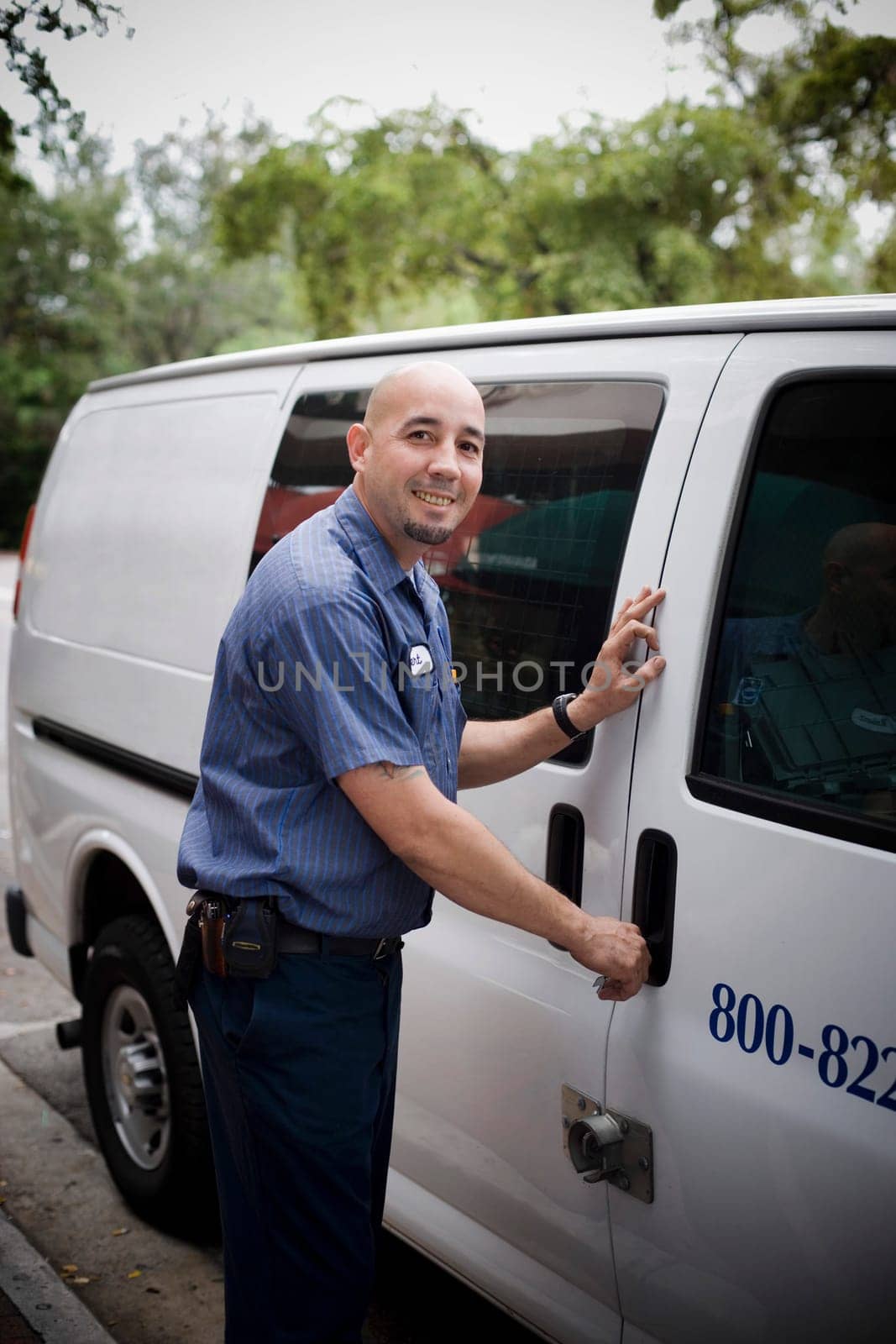 Blue collar worker getting in van