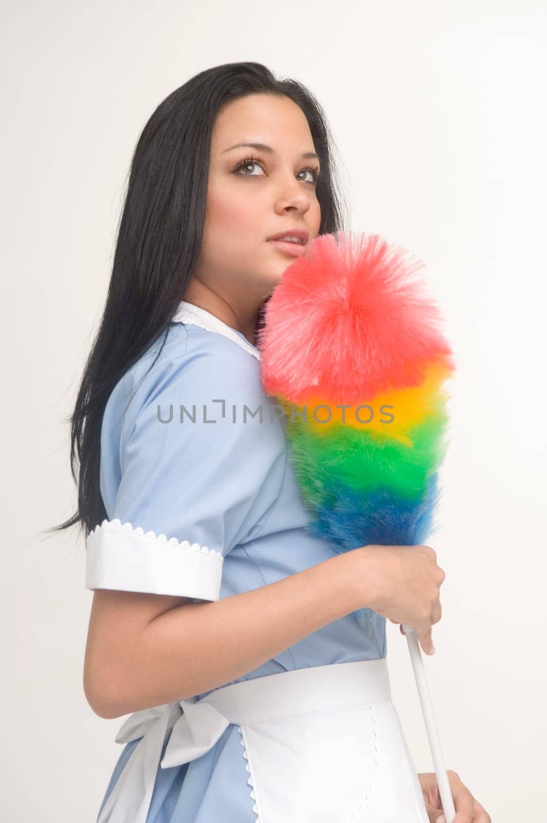 Maid holding feather duster