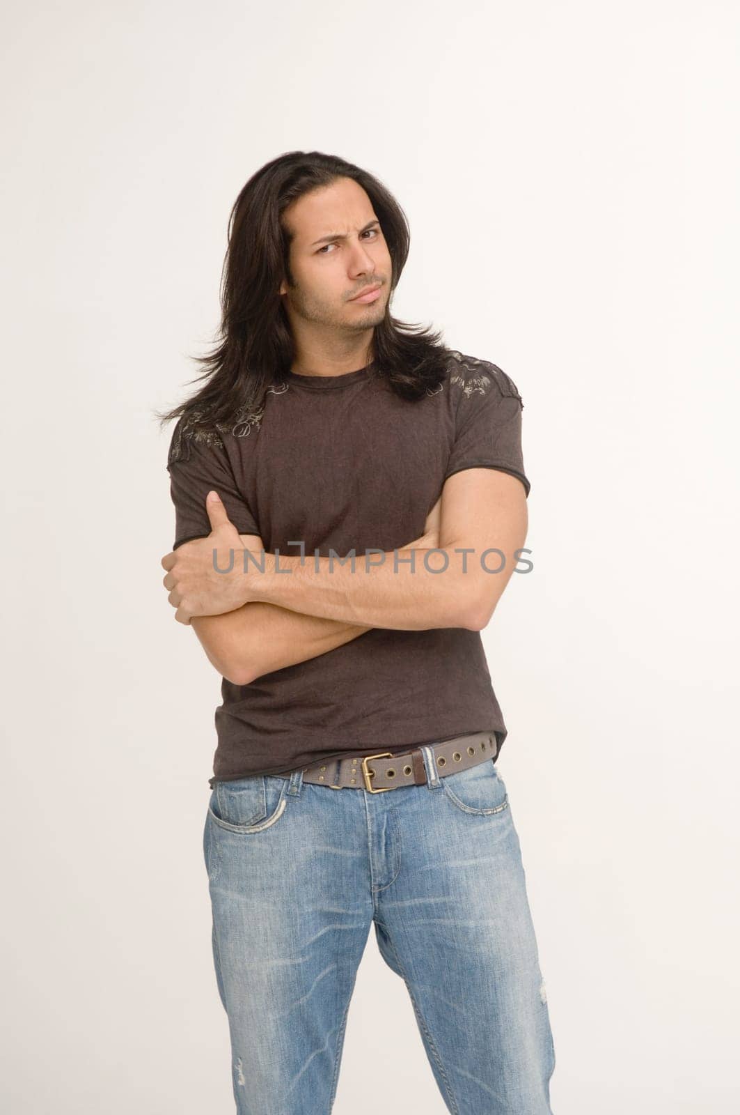 Young man, arms crossed