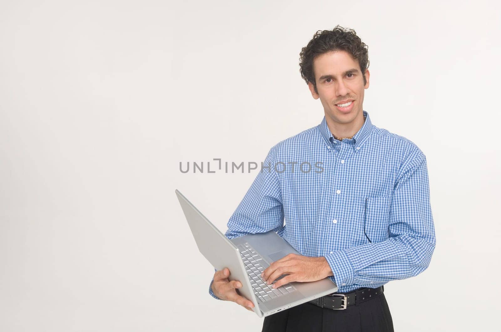 Young man holding laptop