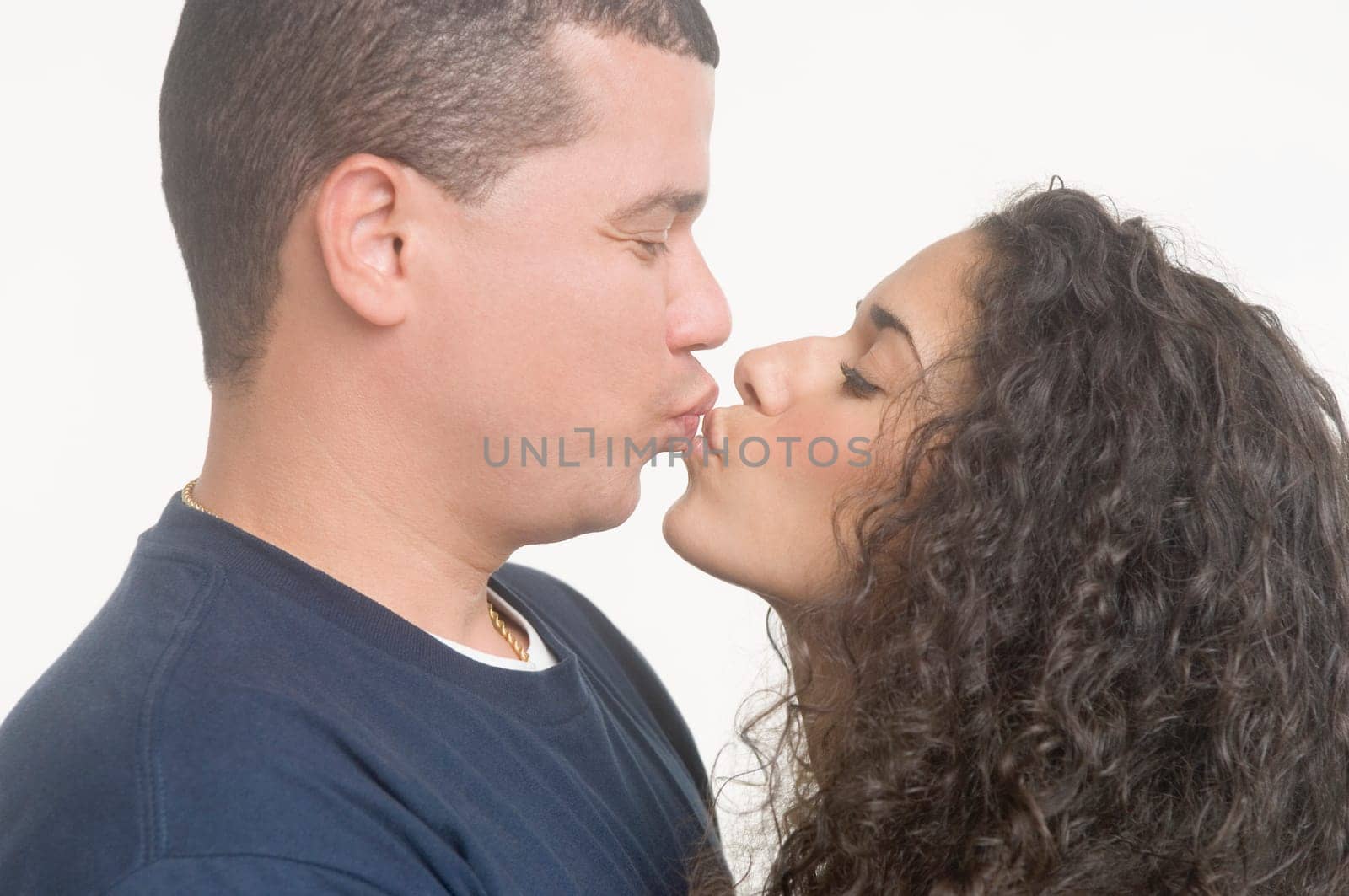 Portrait of young couple kissing
