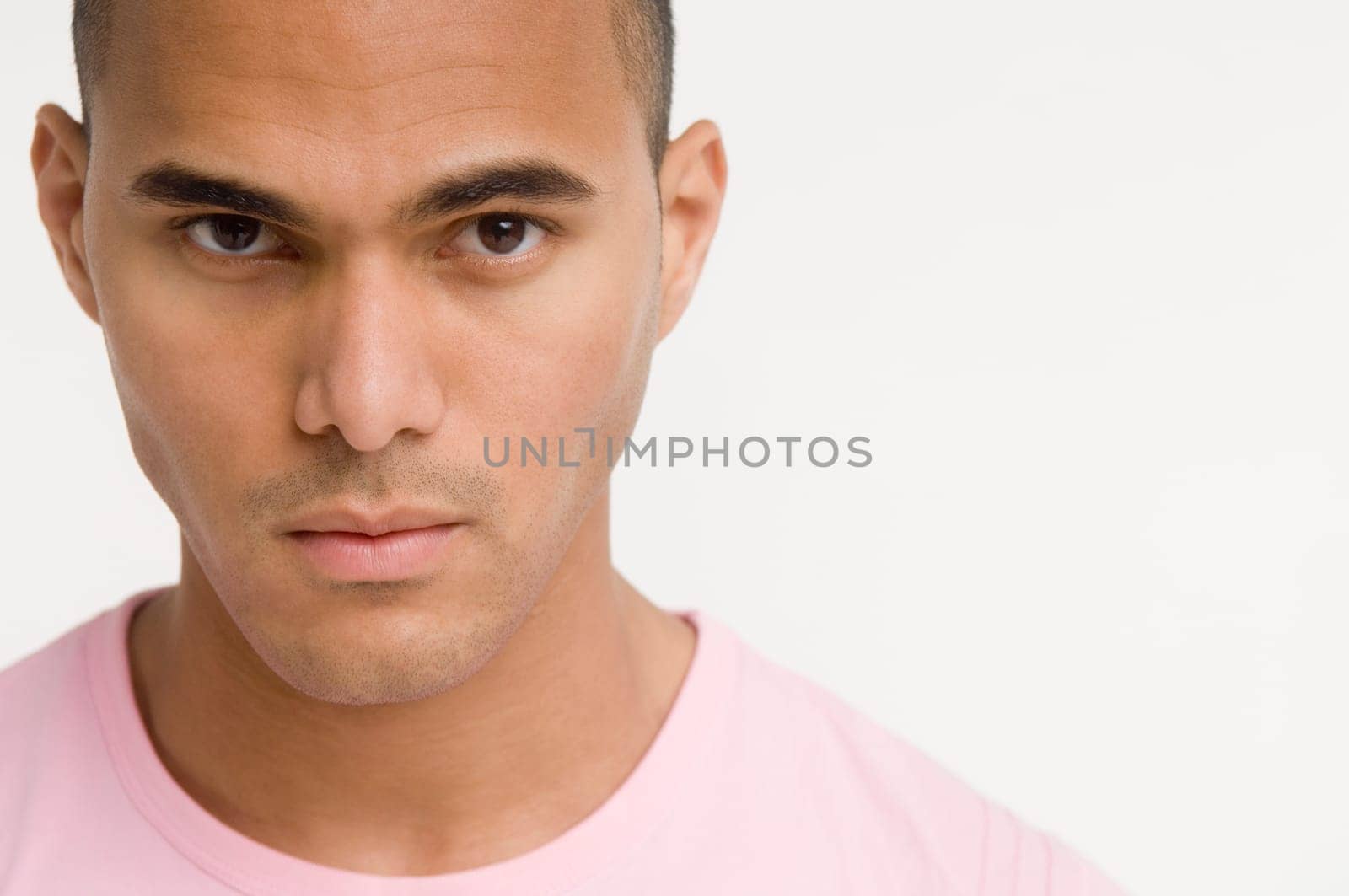 Portrait of young man looking at camera