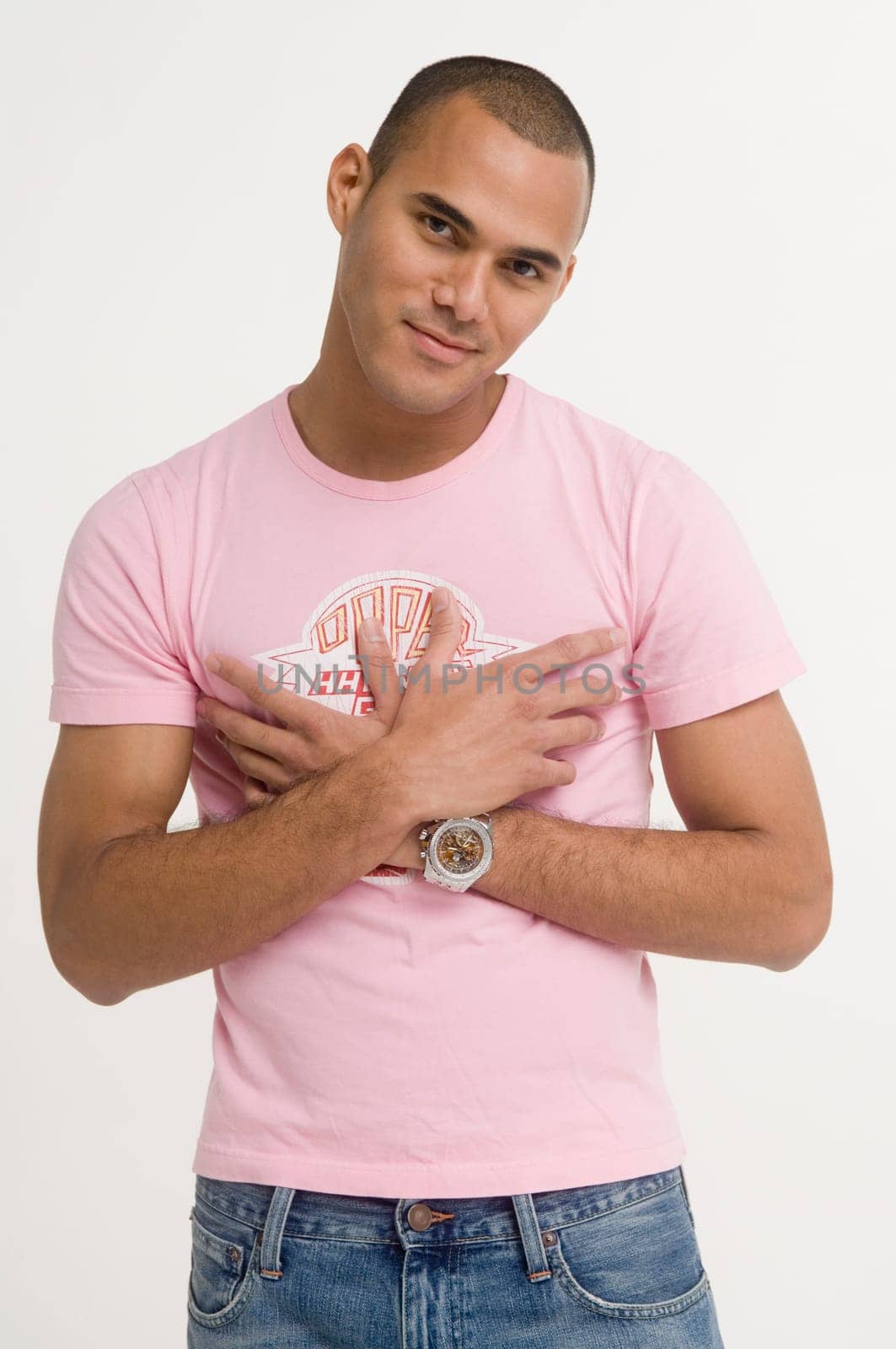 Portrait of young man, hands on chest