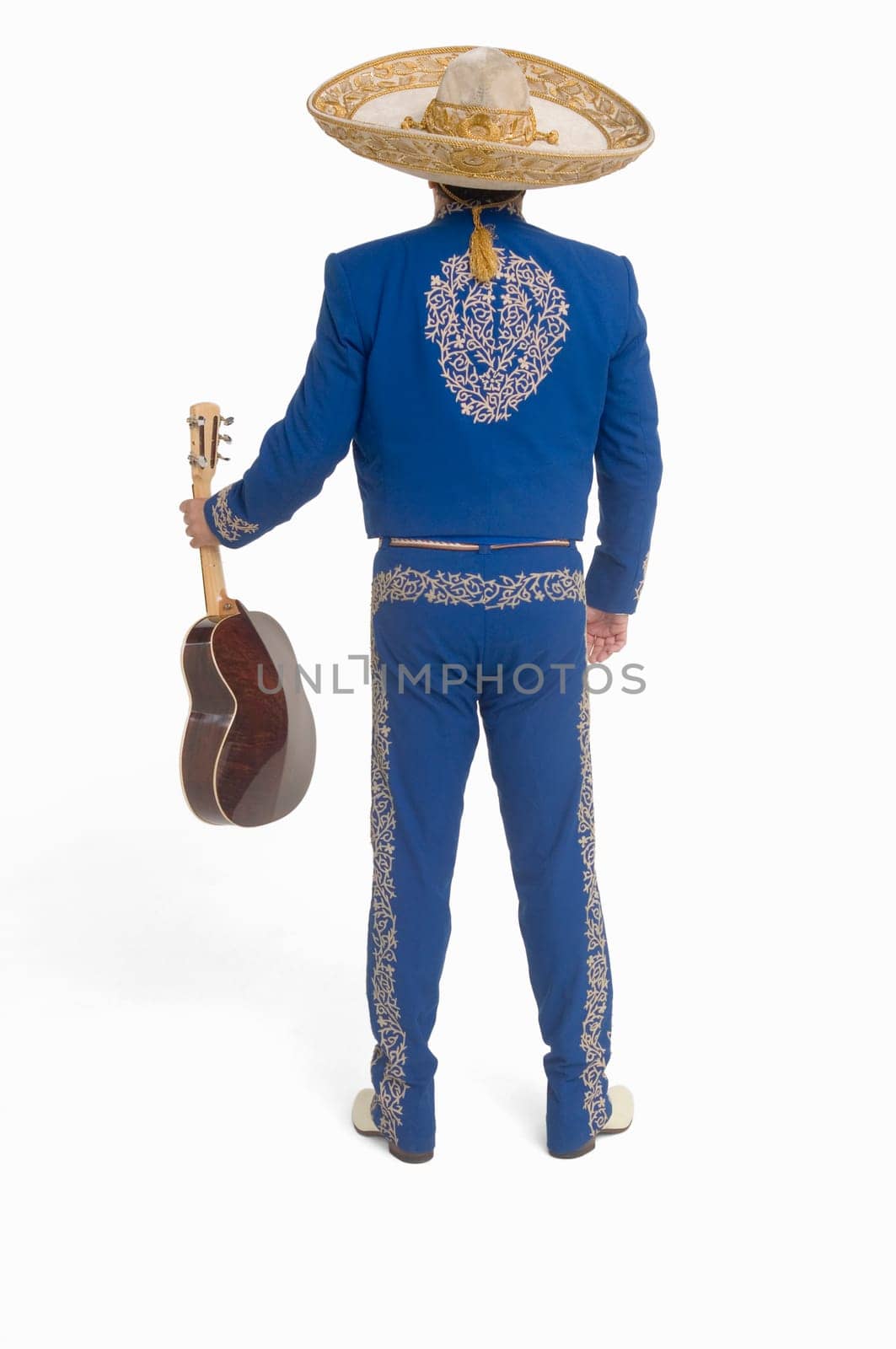 Portrait of Mariachi playing guitar and singing