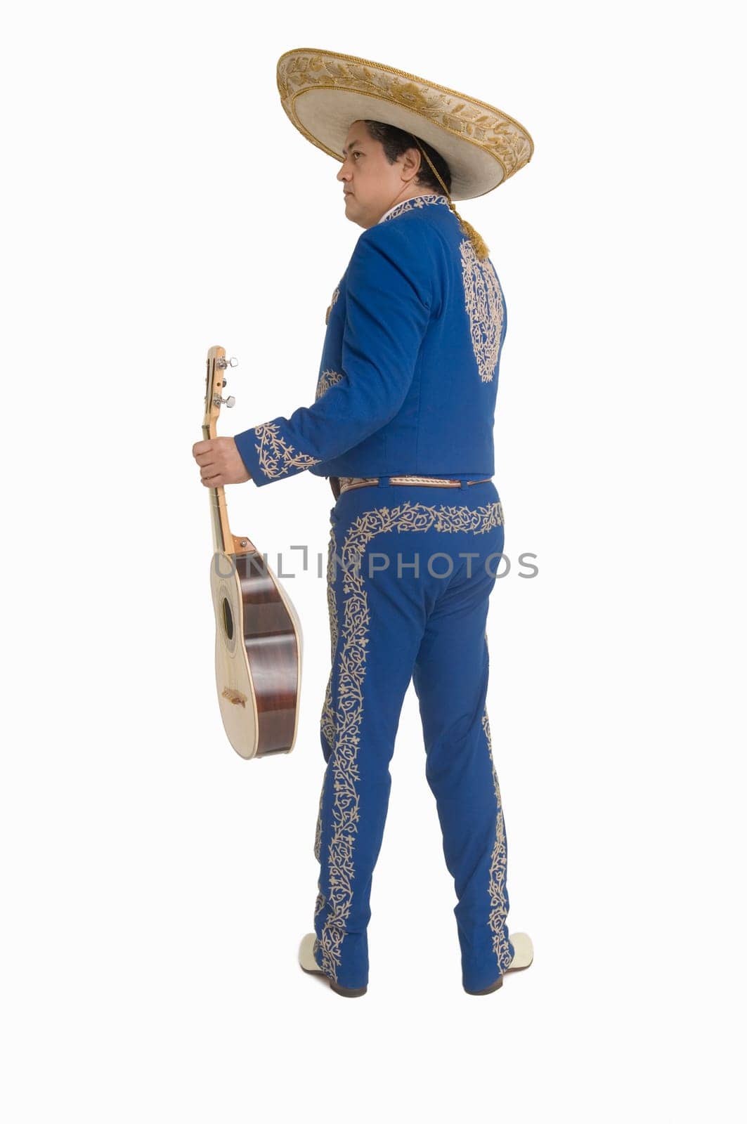 Portrait of Mariachi playing guitar and singing