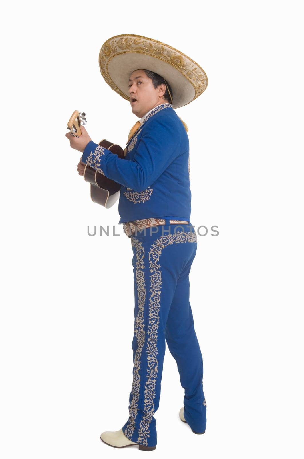 Portrait of Mariachi playing guitar and singing