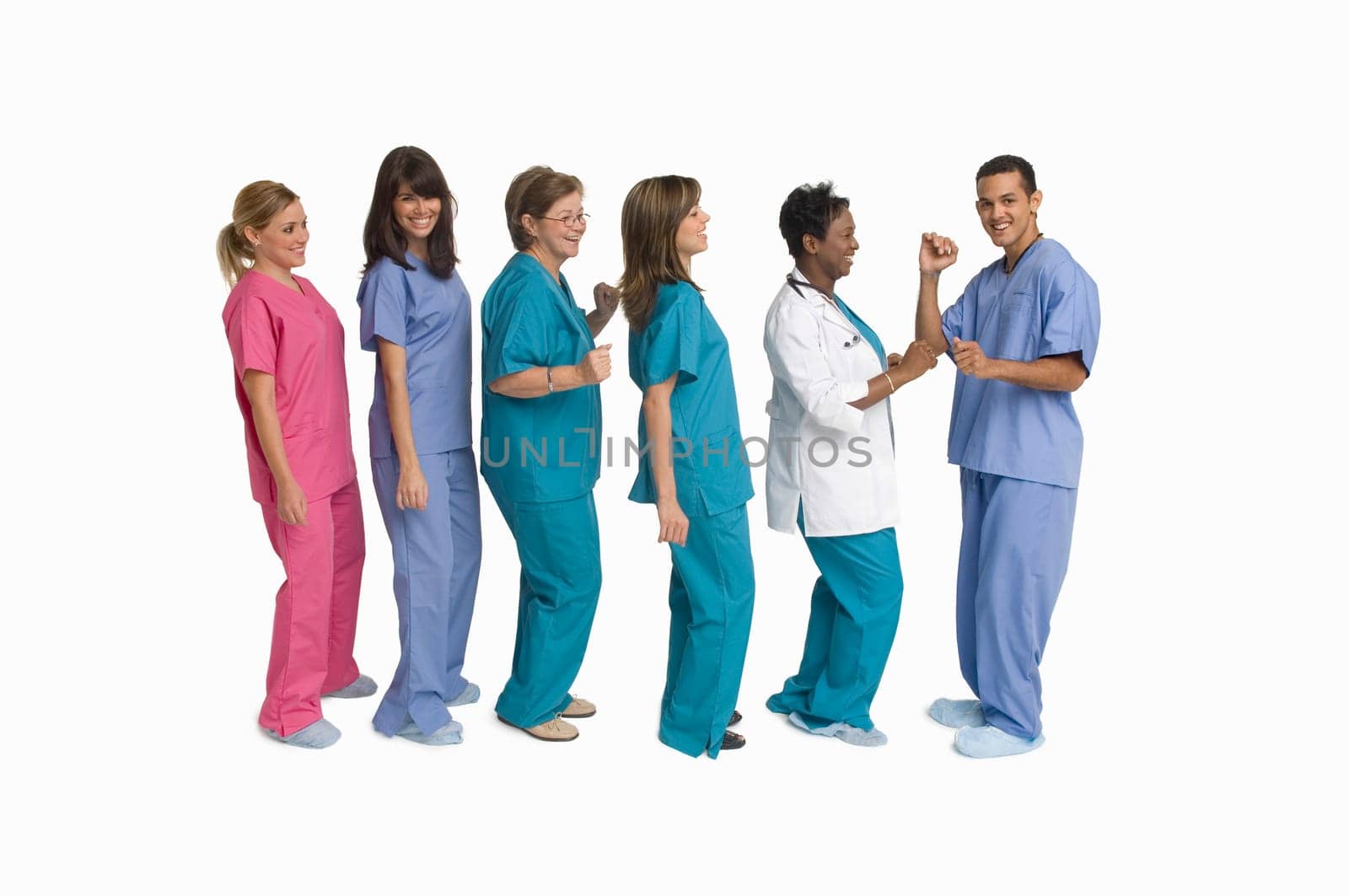 Group portrait of doctors and nurses dancing