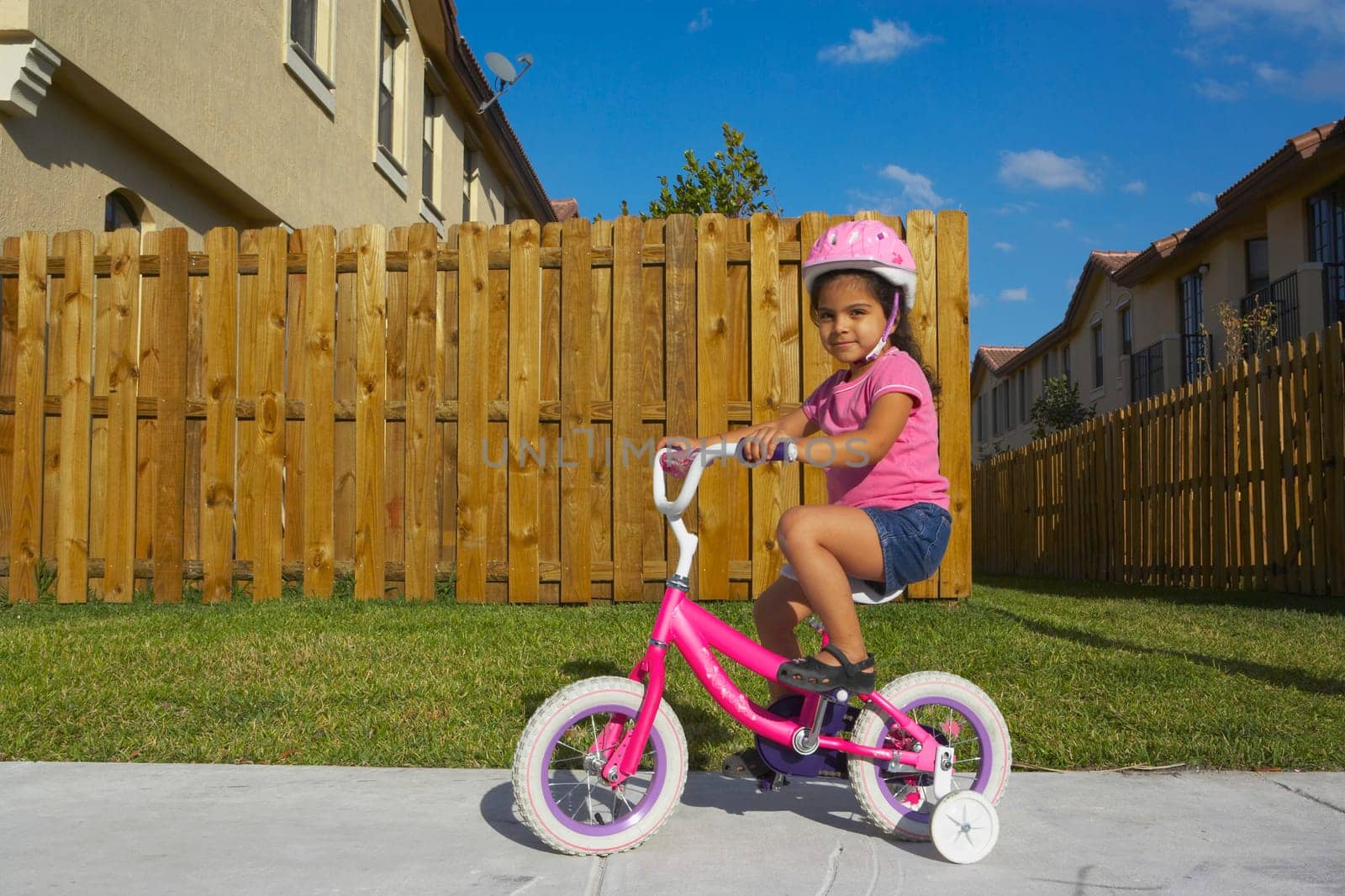Portrait of a girl riding a bicycle on a path