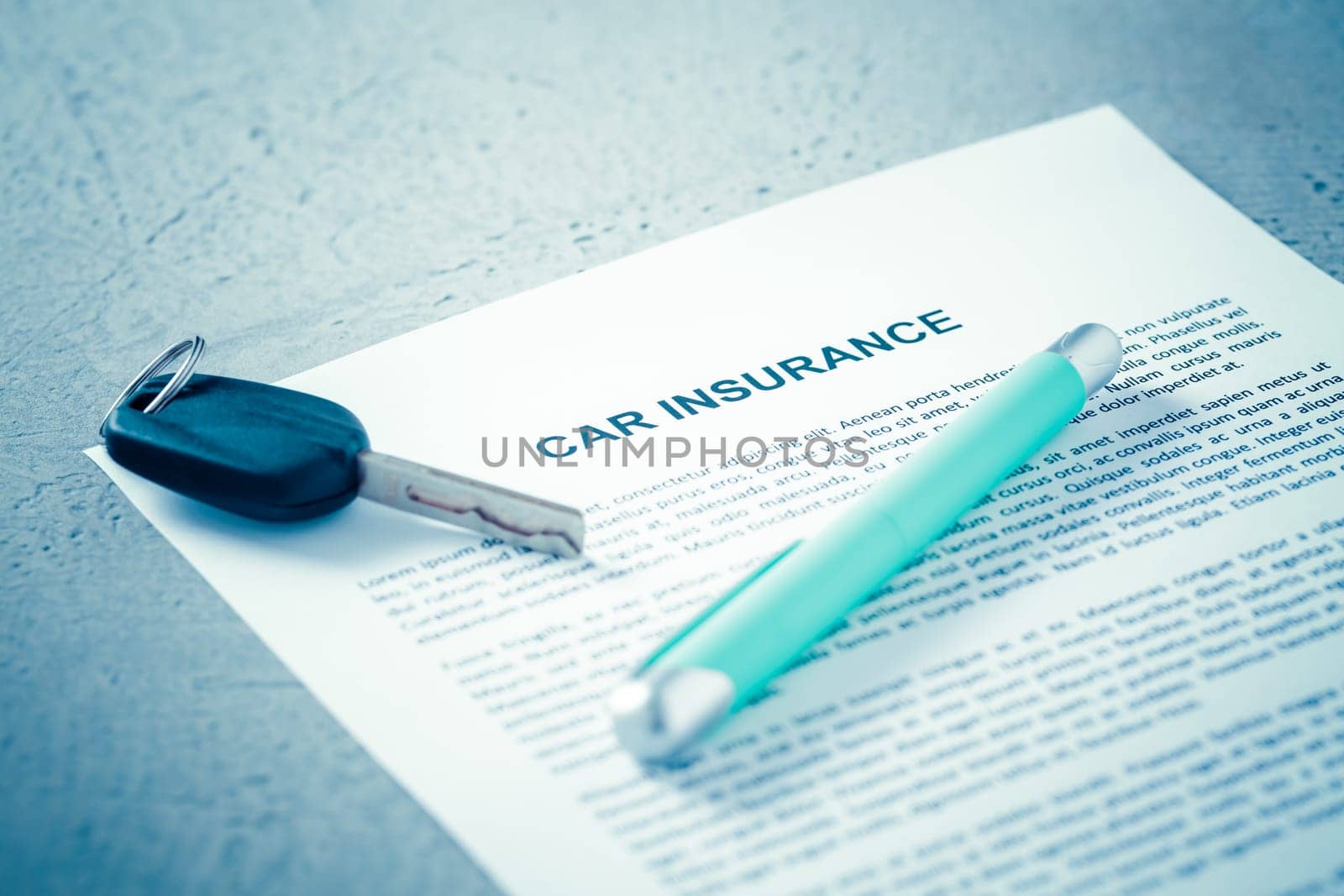 Concept of car insurance - car policy with car keys on blue tone