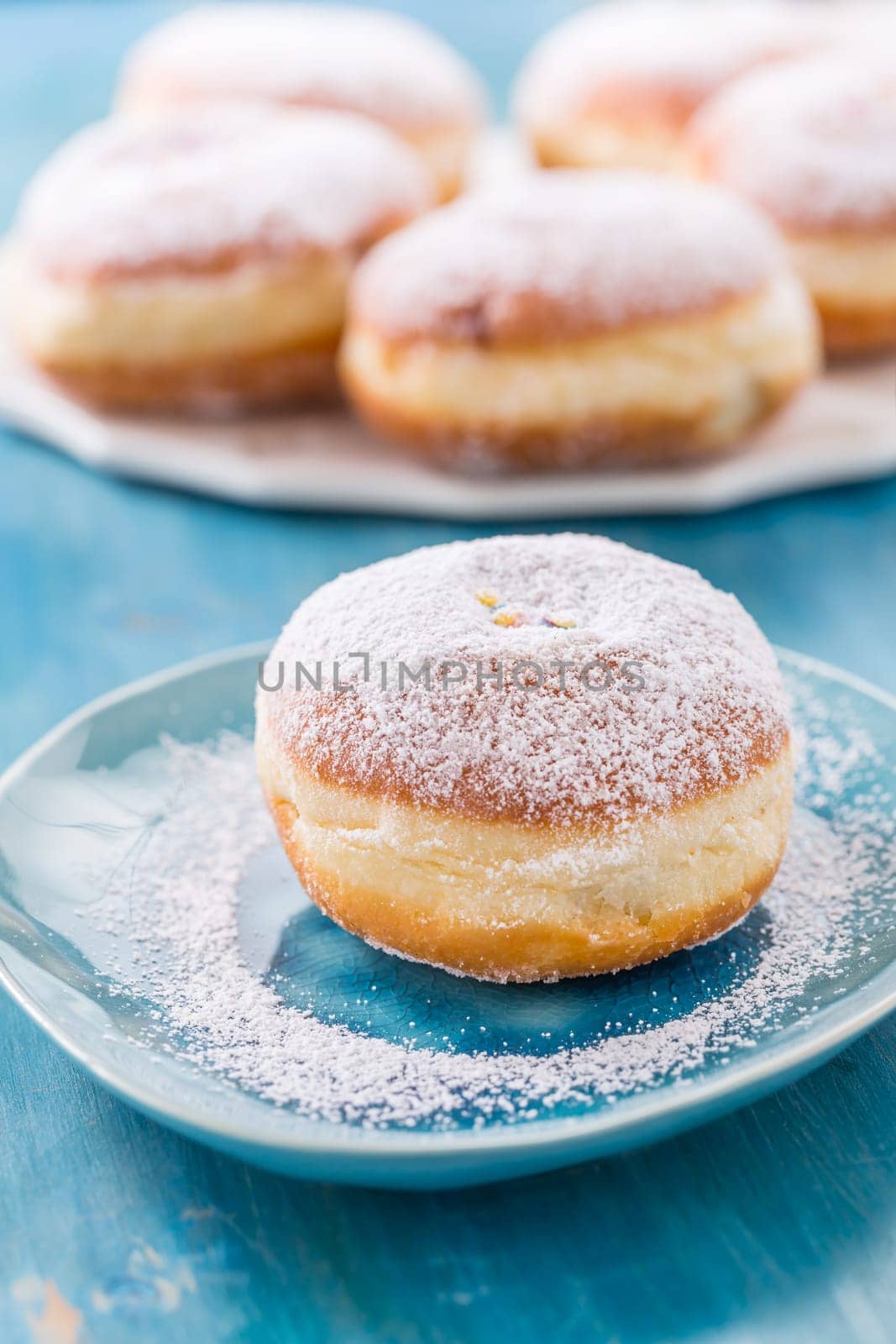 Traditional German Krapfen, Berliner or donuts with icing sugar