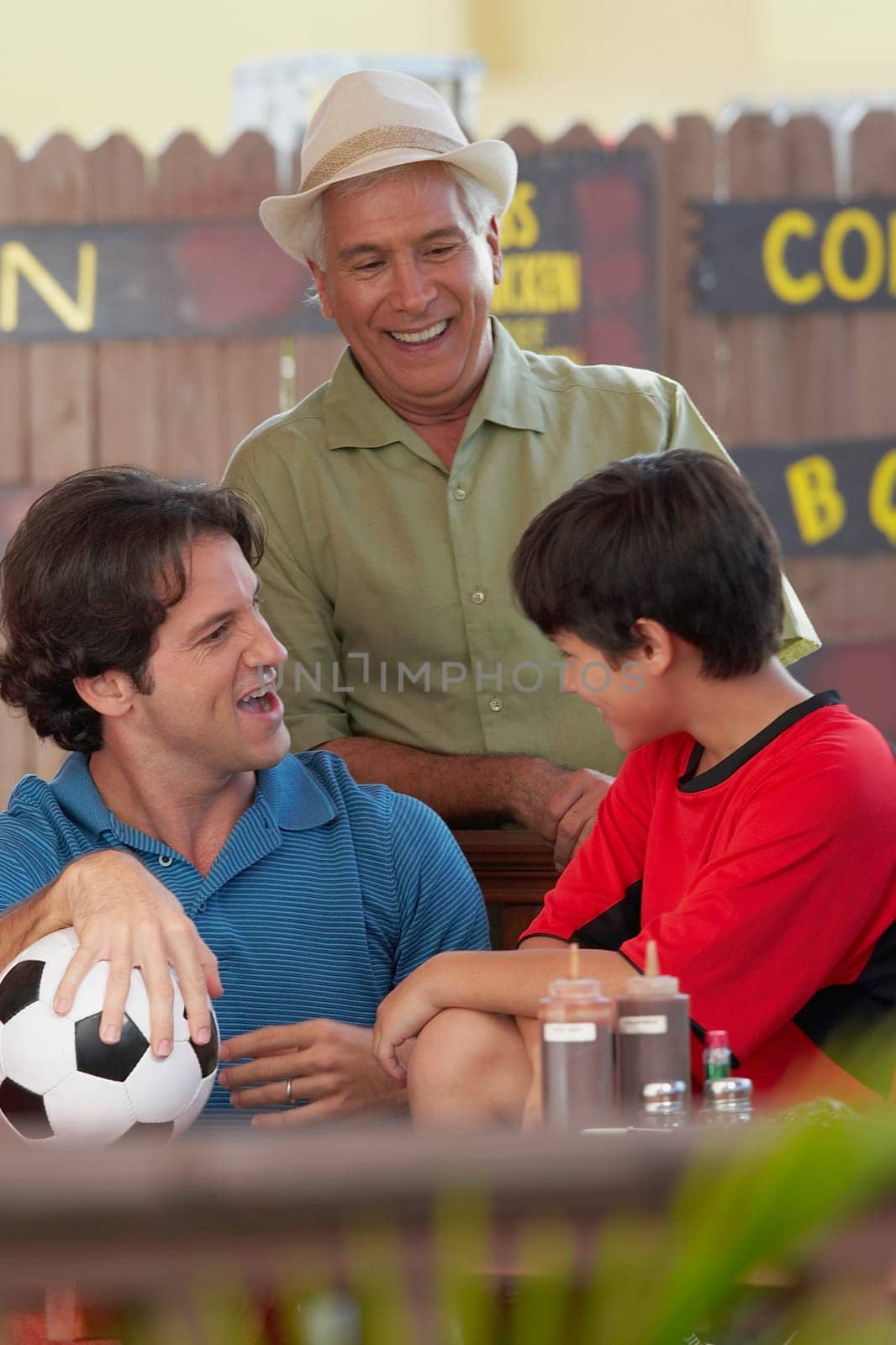 Mid adult man with his father and his son in a restaurant