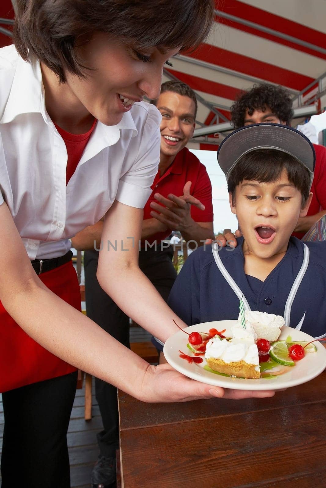 Boy celebrating his birthday in a restaurant