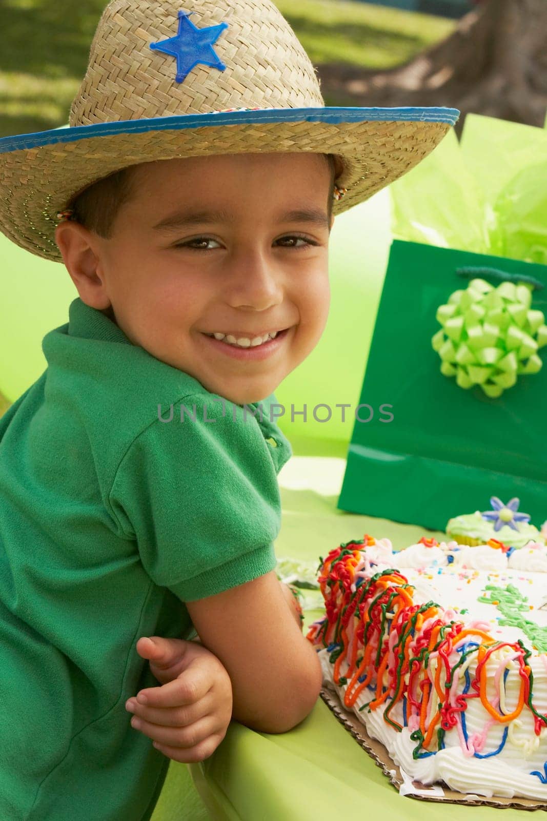 Portrait of a boy wearing a cowboy hat at a birthday party