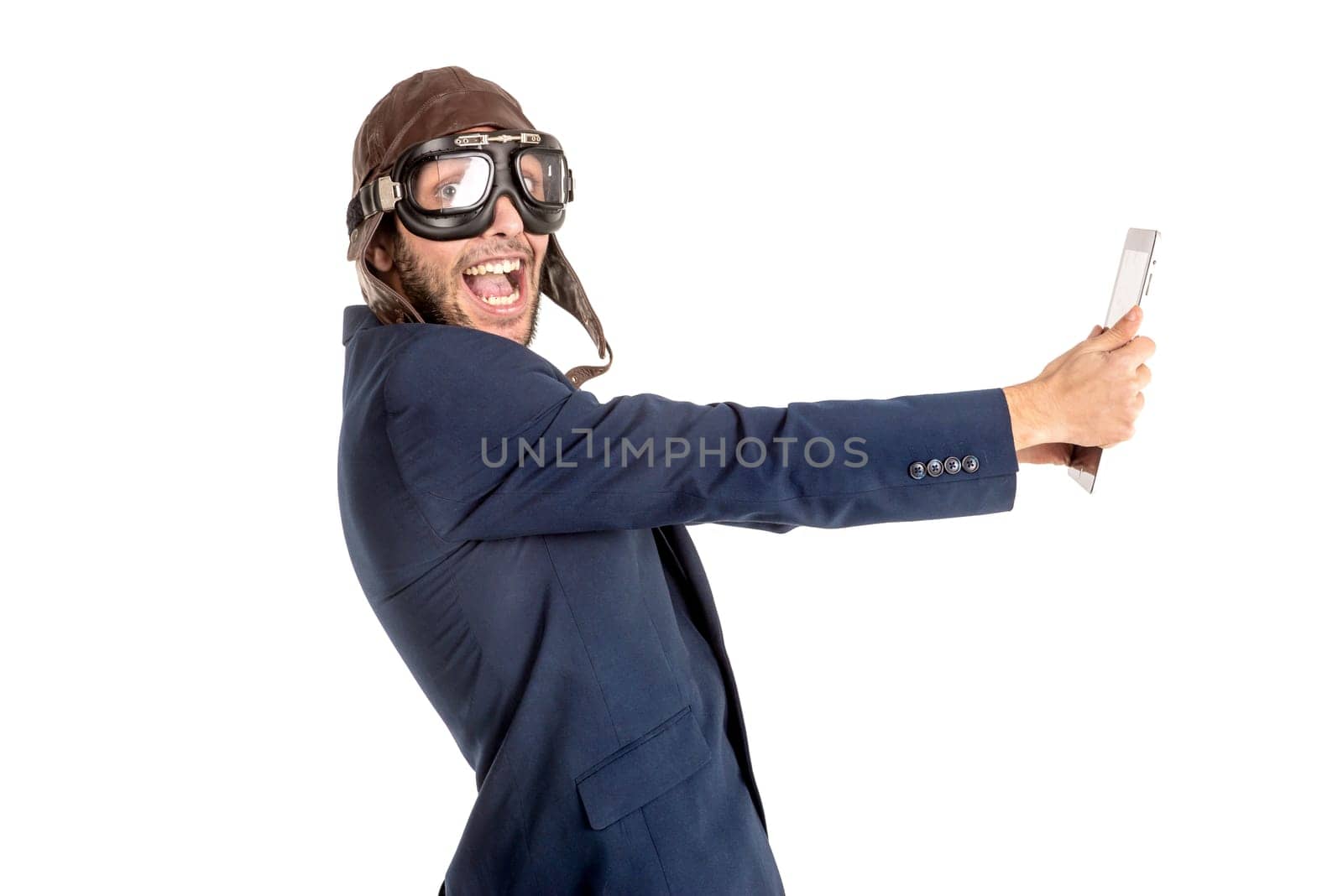 Businessman with pilot goggles and tablet isolated in white