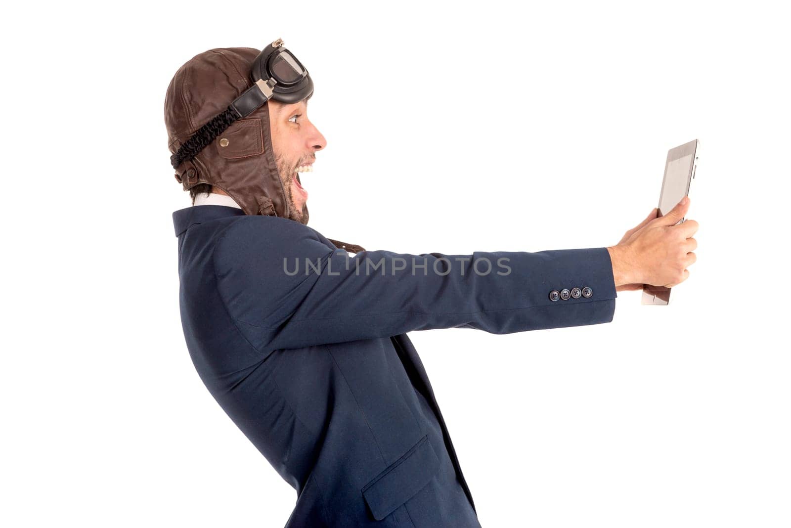 Businessman with pilot goggles and tablet isolated in white