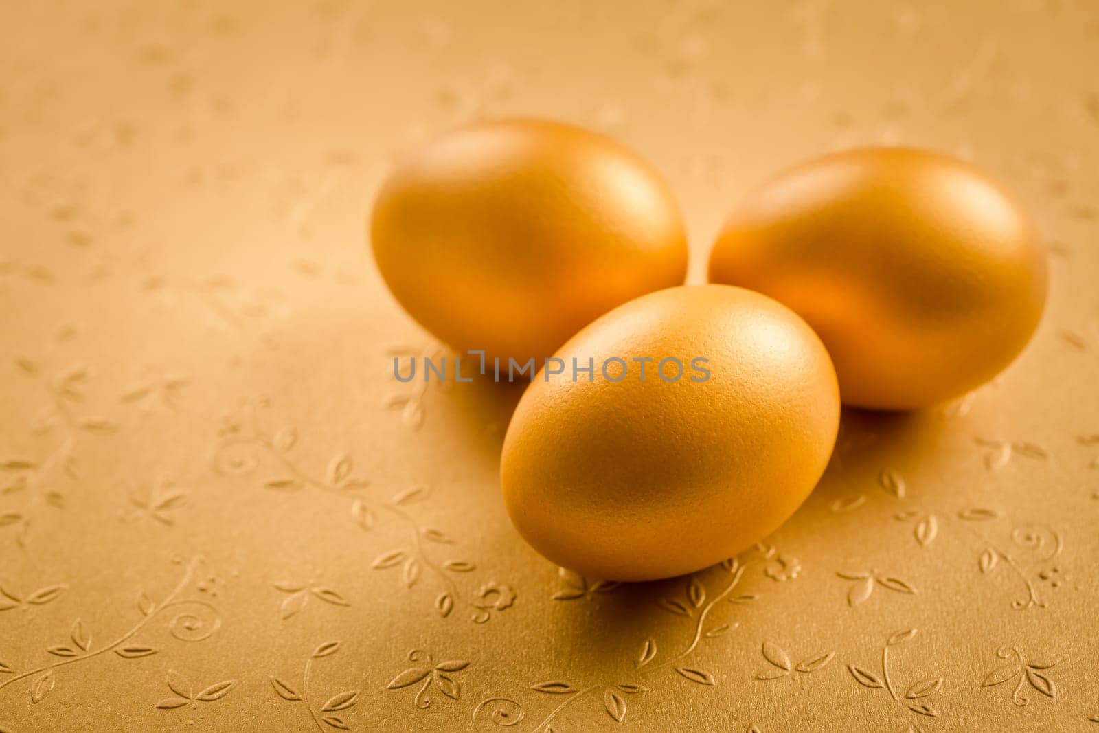 Golden egss on golden background for Easter