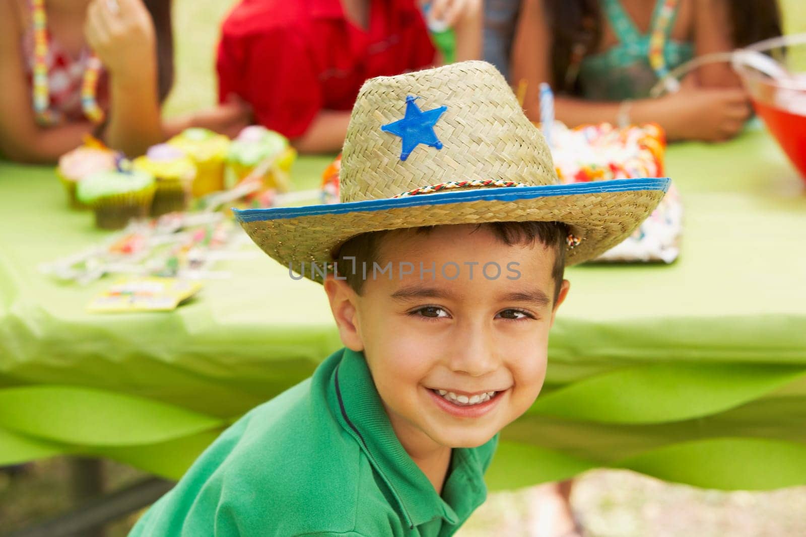 Close-up of a boy smiling at a birthday party