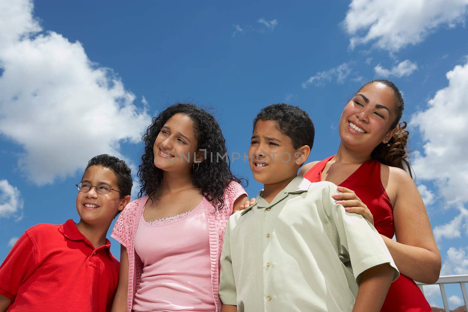 Close-up of two boys and two teenage girls smiling