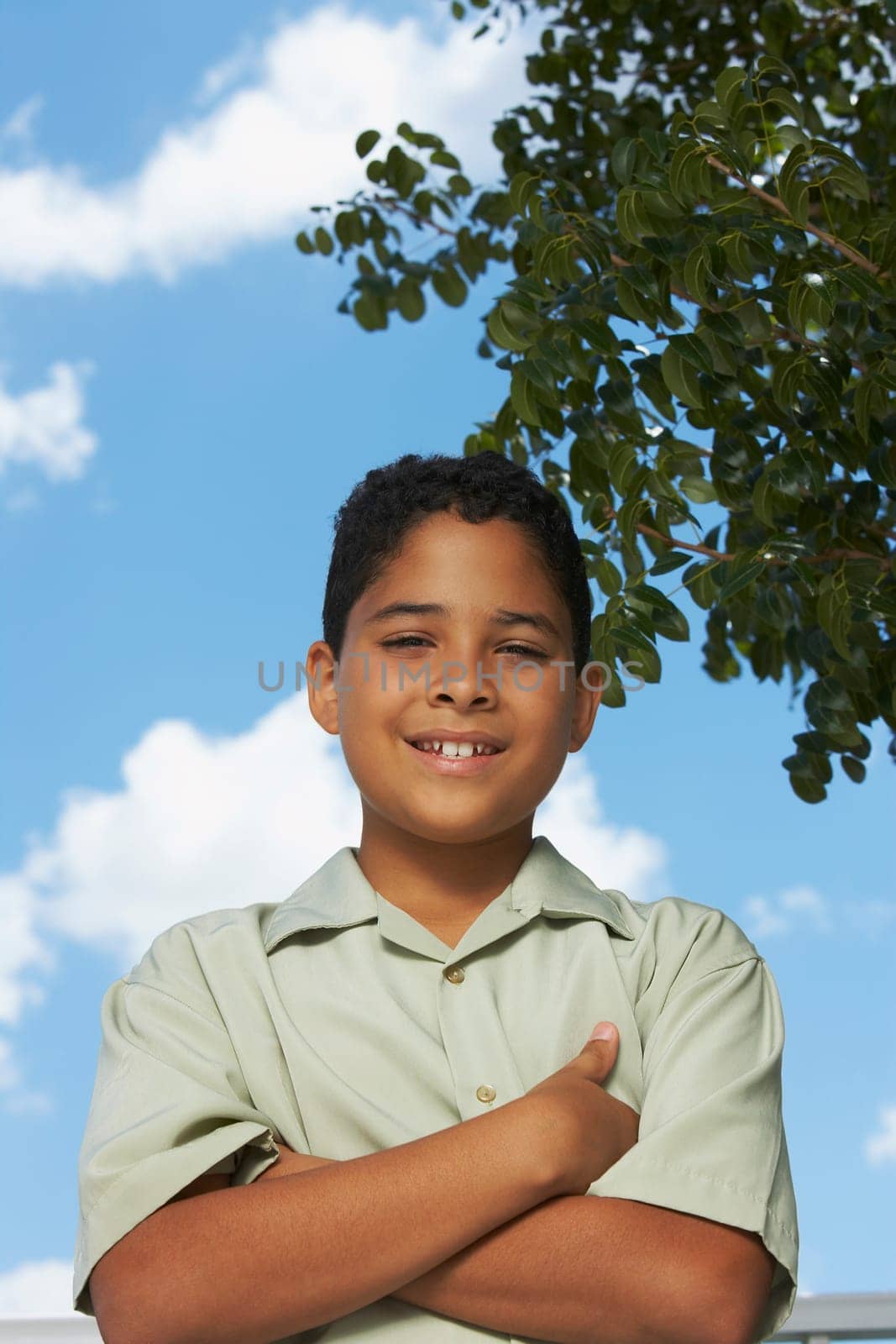 Portrait of a boy with his arms crossed