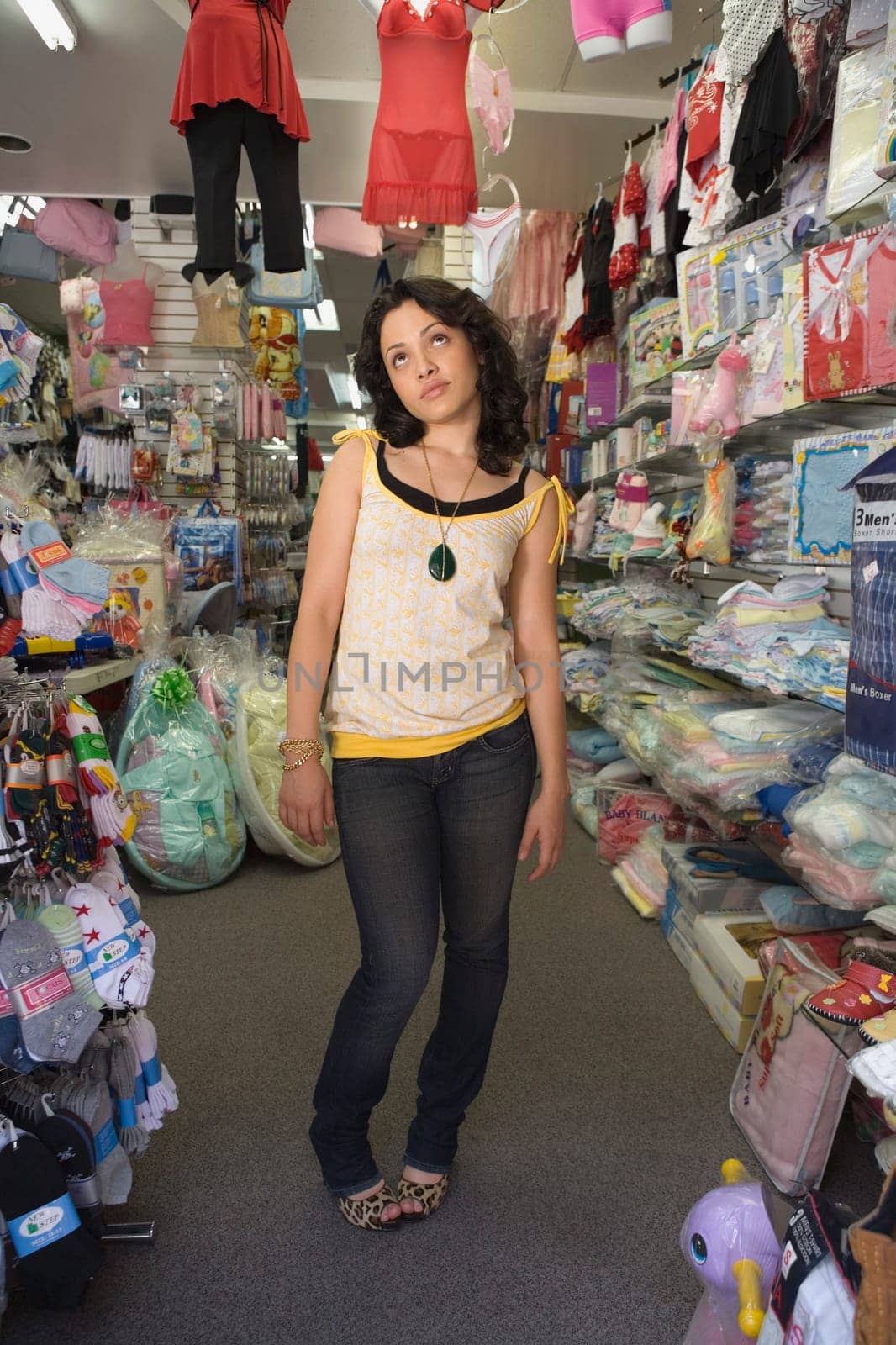 Young woman standing in a baby shop