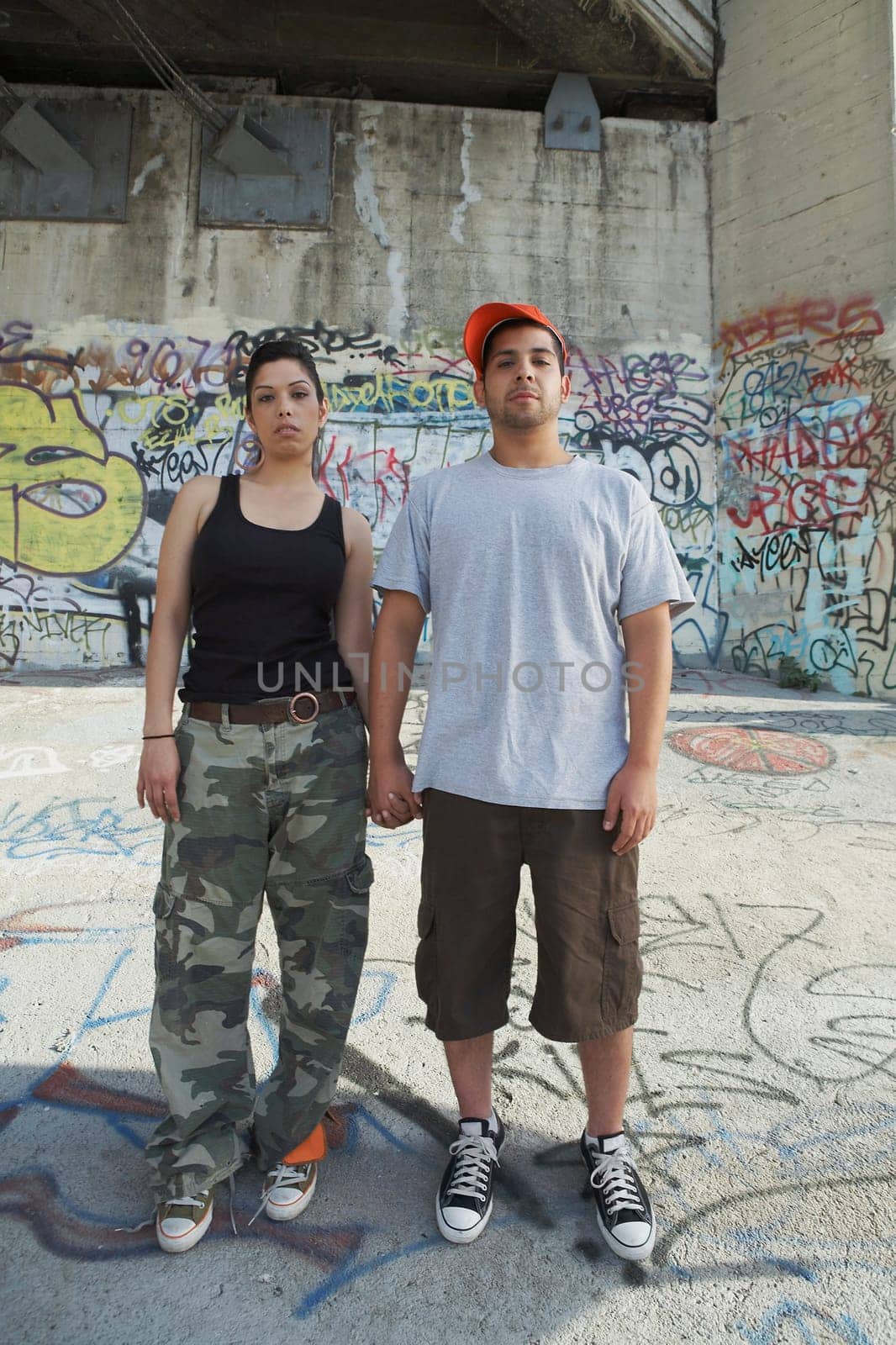 Portrait of a young couple holding each other's hand