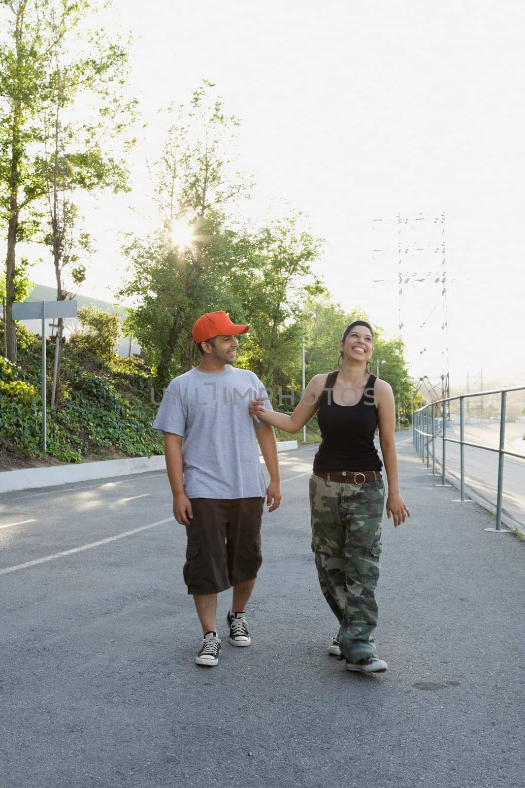 Young couple walking on the road and smiling