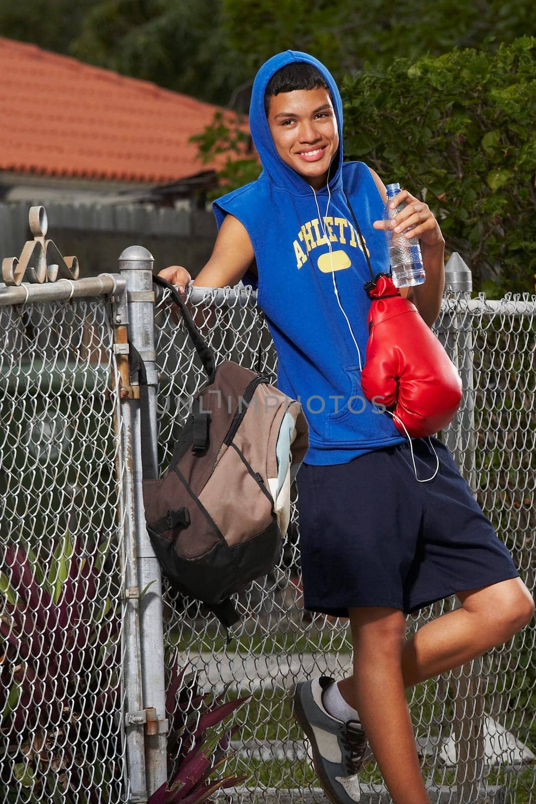 Portrait of a teenage boy listening ipod and smiling
