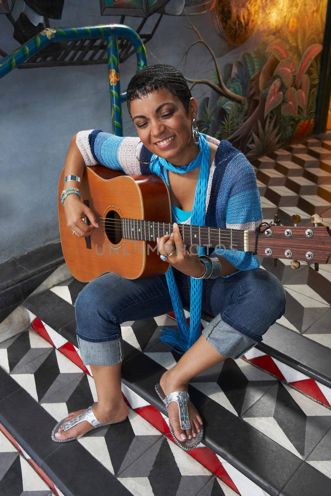 Young woman playing a guitar