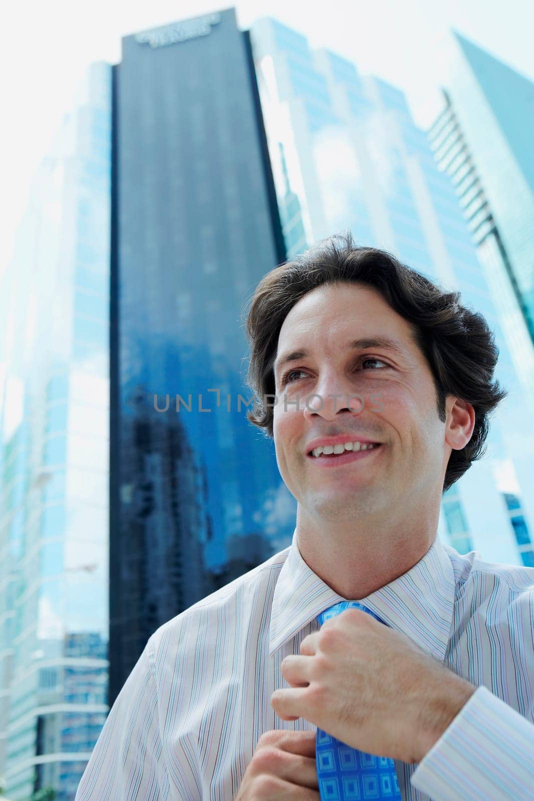 Businessman adjusting his tie