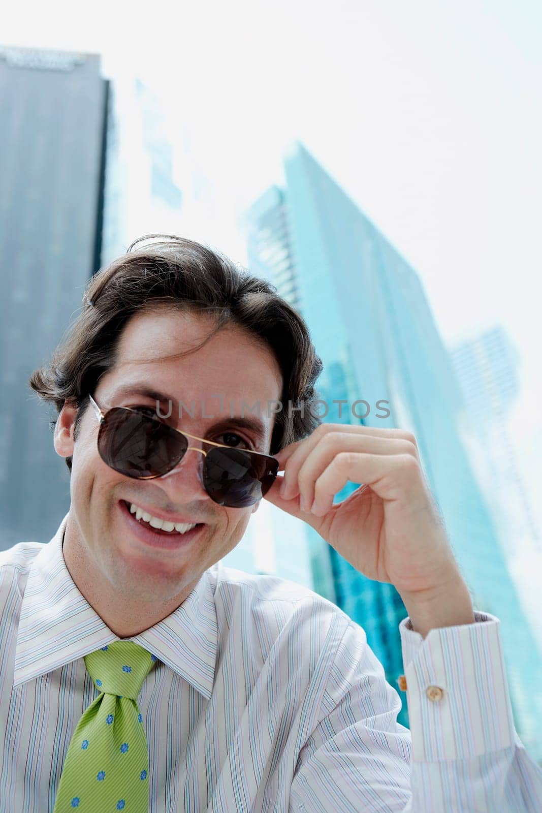 Portrait of a businessman wearing sunglasses and smiling