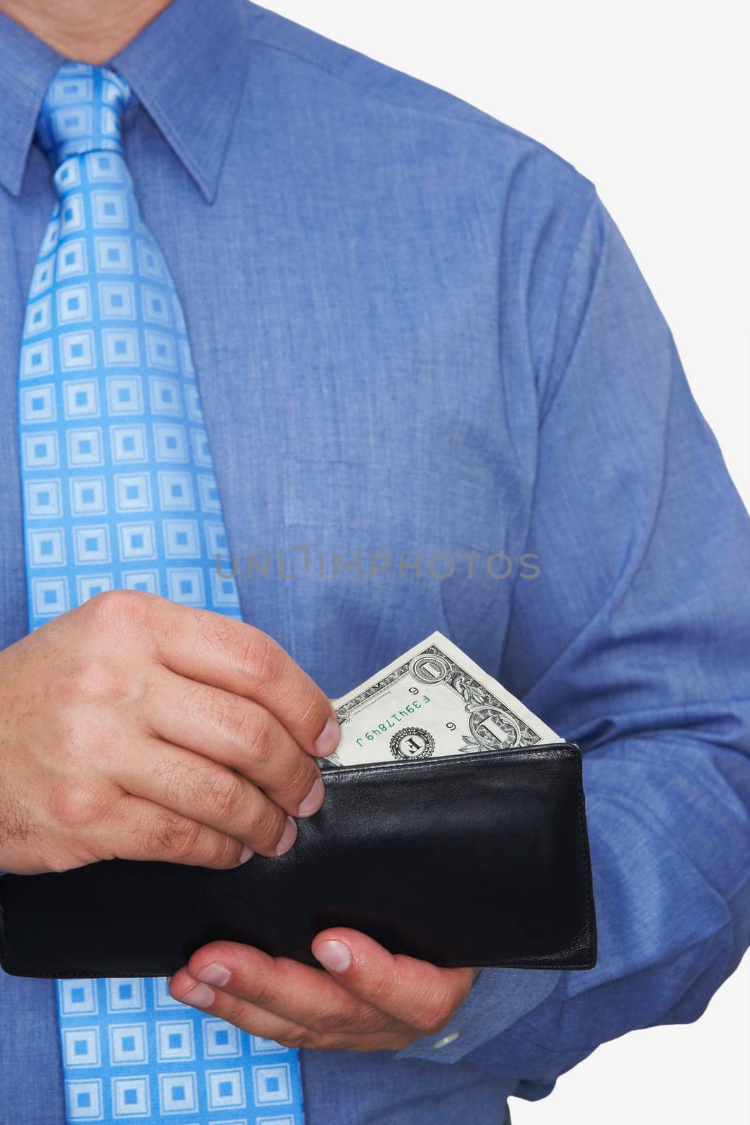 Mid section view of a businessman taking one dollar bill out of his wallet