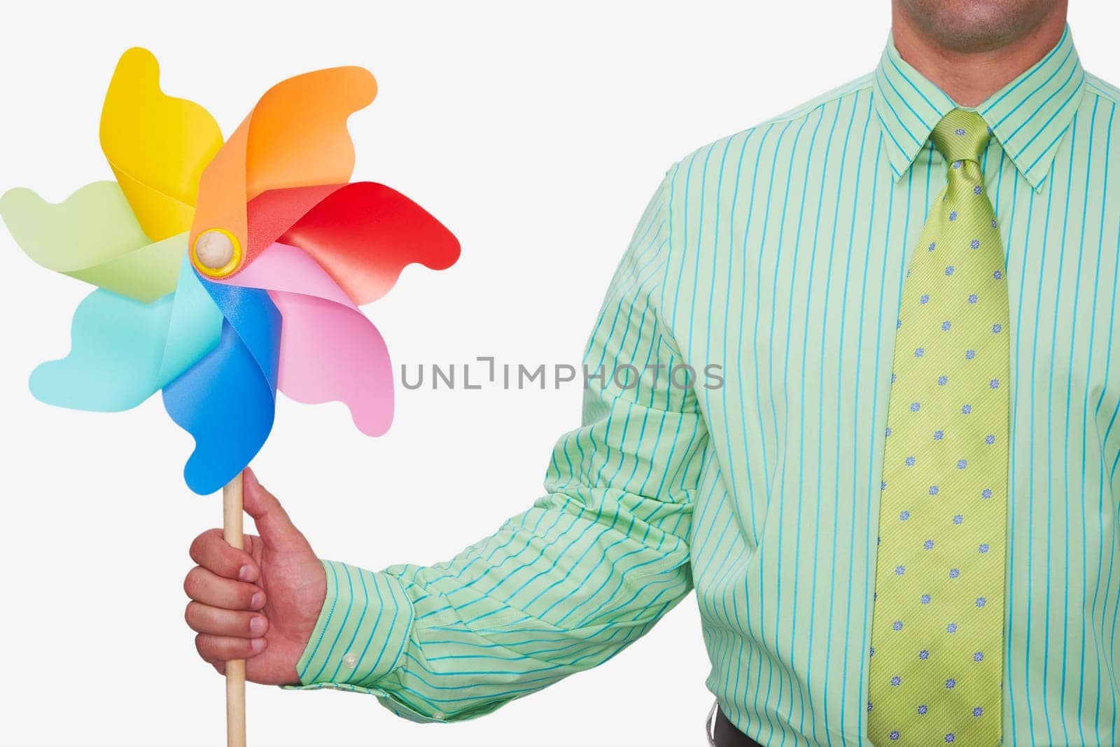 Mid section view of a businessman holding a pinwheel
