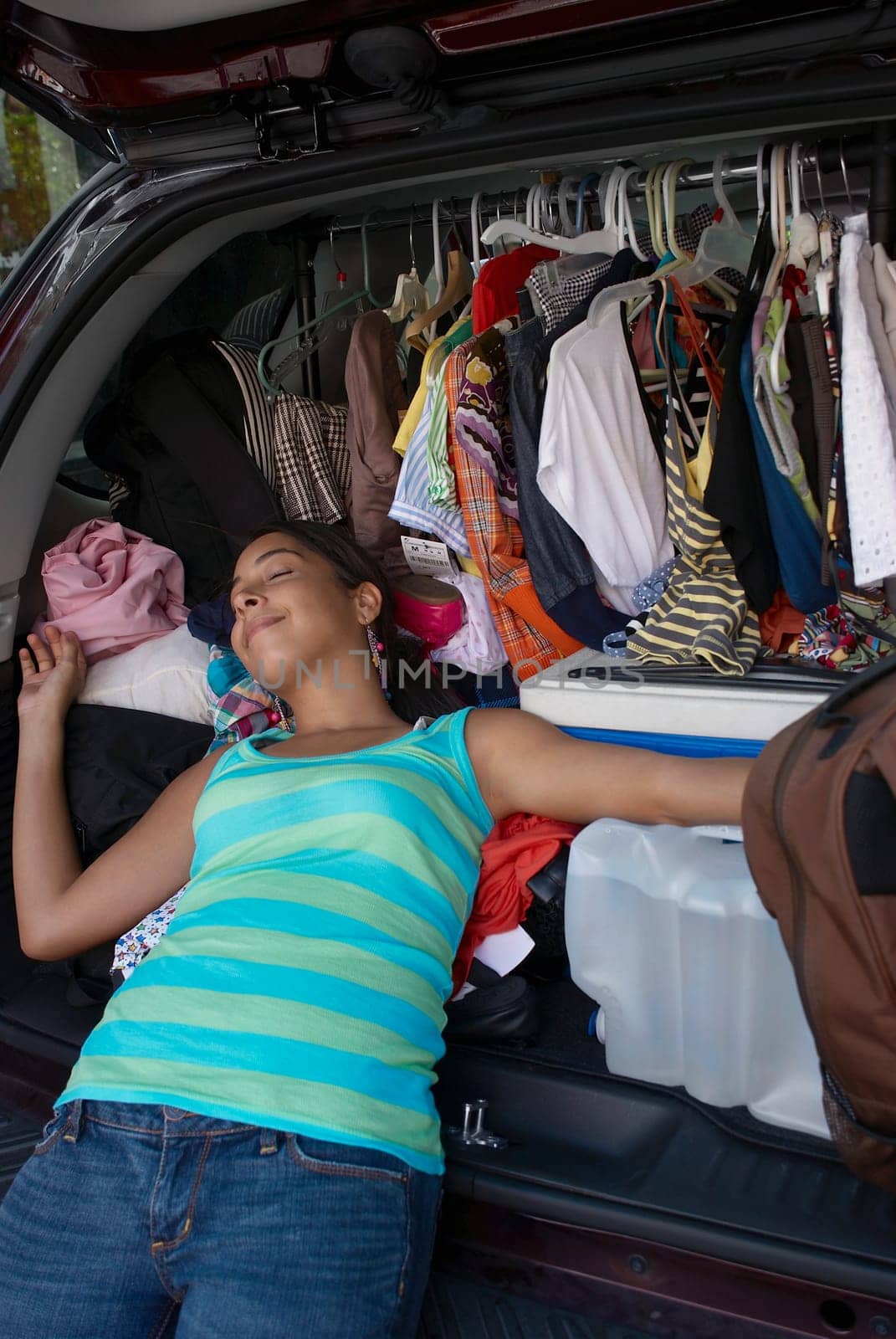 Close-up of a young woman sleeping in a car